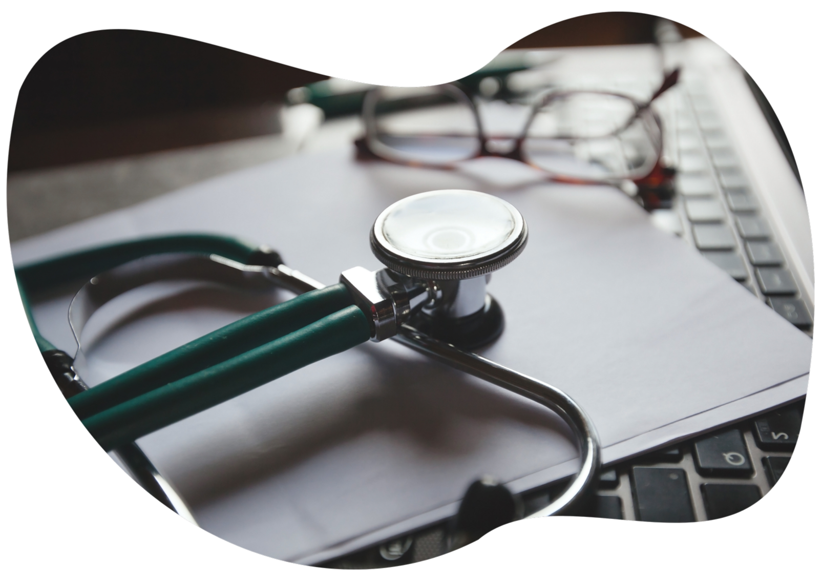 Stethoscope and blood pressure cuff on an electrocardiogram paper.