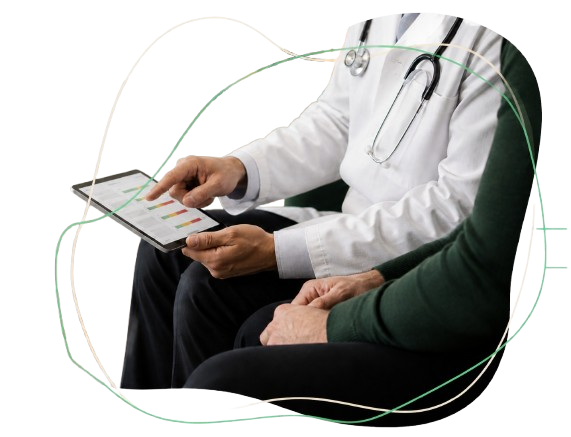 Doctor and patient sitting side by side, with the doctor holding a tablet displaying colorful data, in a medical setting.
