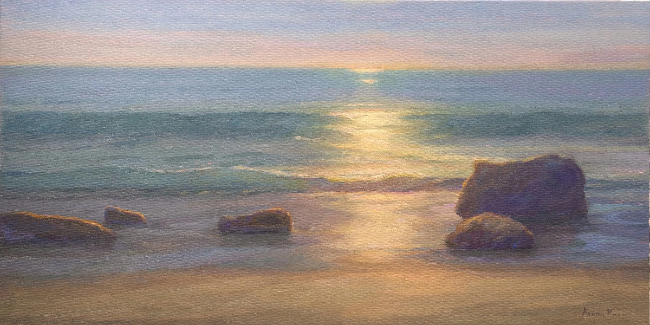 Silver and Stone, an 18 × 36 inch coastal oil painting featuring silver morning light shimmering across shallow ocean water as waves move around dark shoreline rocks beneath a soft atmospheric sky.