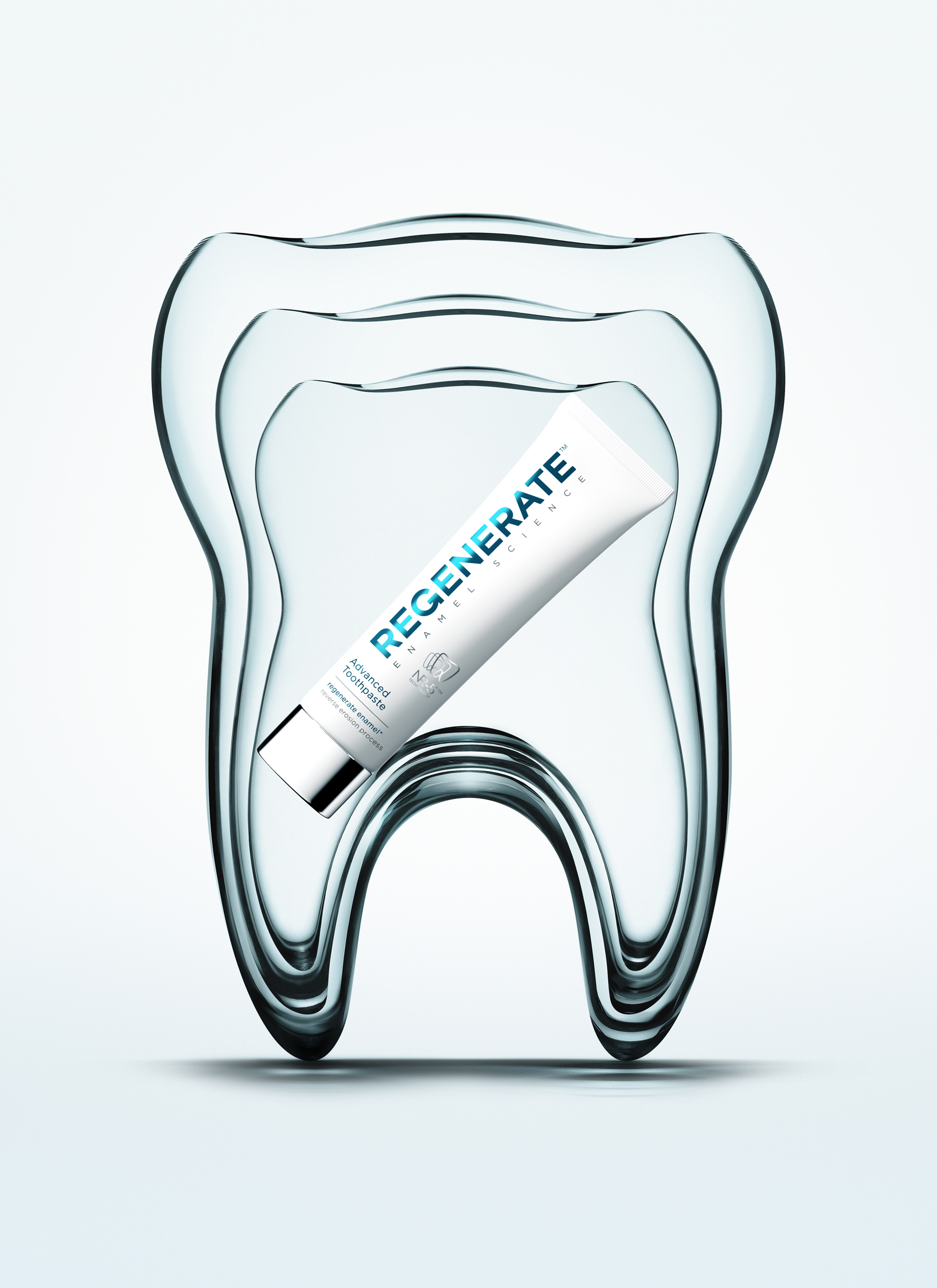 Hero key visual of the Regenerate toothpaste tube centered within three layered glass tooth forms, symbolizing multi-layer enamel protection and restorative science.