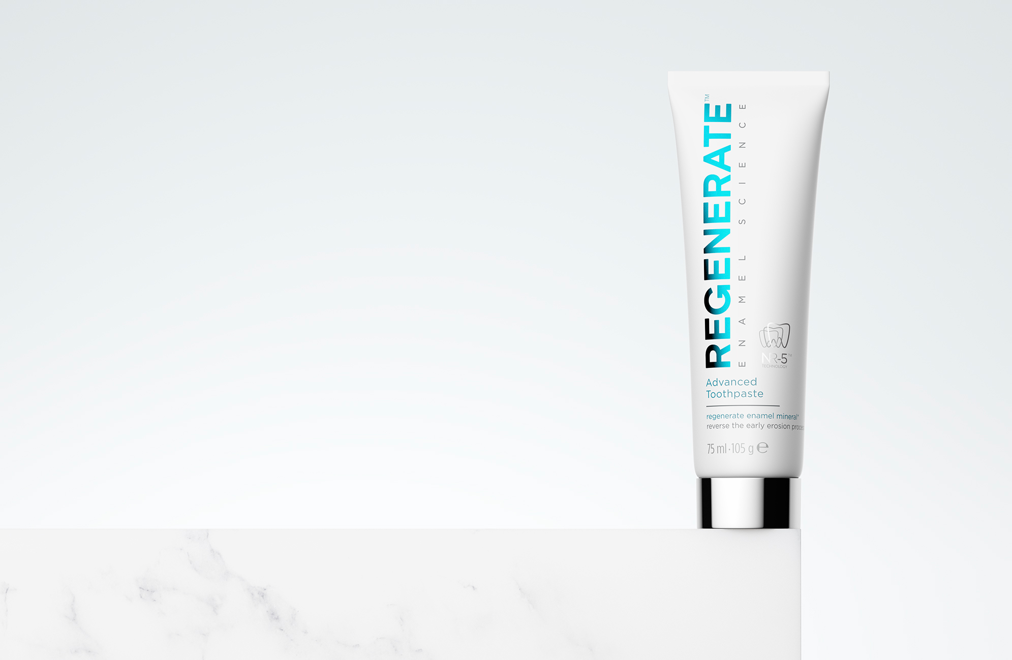 Minimal CGI render of the Regenerate toothpaste tube placed on a marble block against a bright background, emphasizing purity, precision, and refined design.
