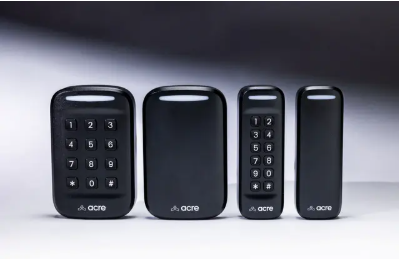 Four black wireless remote controls, with the first and third showing numeric keypads and the second and fourth being plain and smaller.