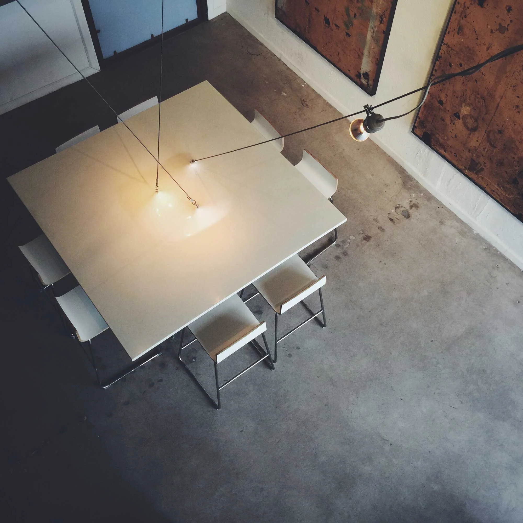 view looking down onto the fabric formed GFRC concrete conference table, showing the integrated lighting