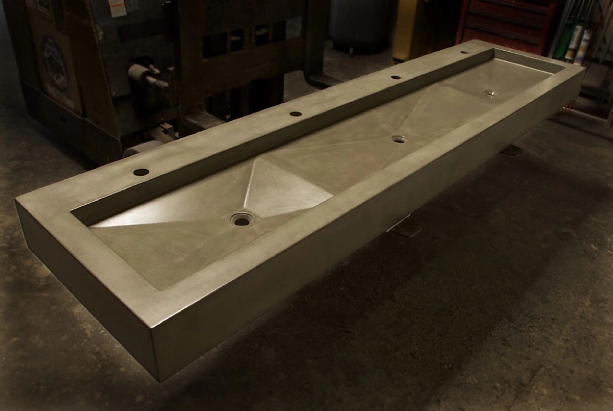 Handcrafted concrete sink designed for commercial and hospitality bathrooms.