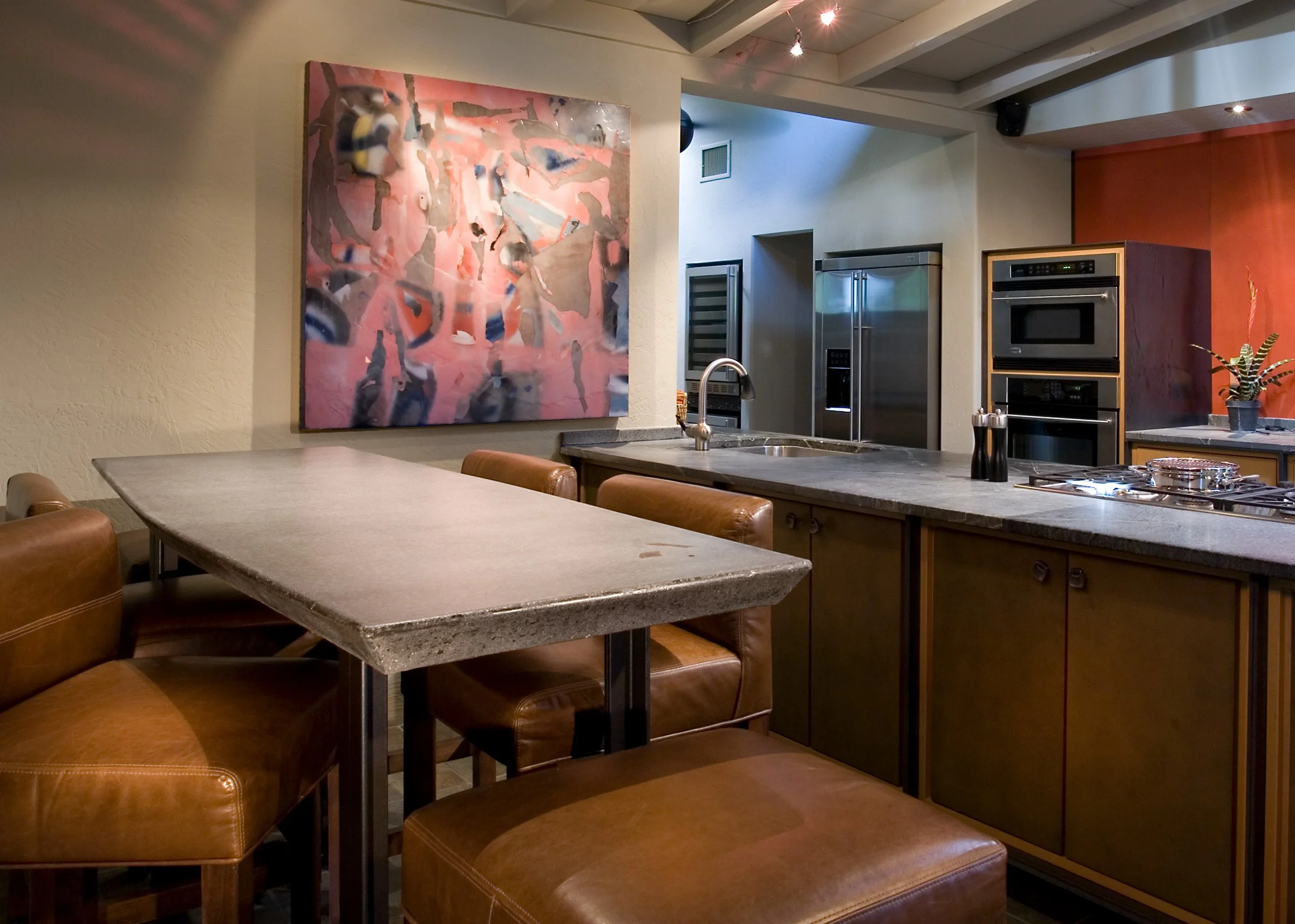 Custom concrete dining table with meteorite inlay. Handcrafted charcoal concrete surface with refined edge detail, built to be timeless and unique.