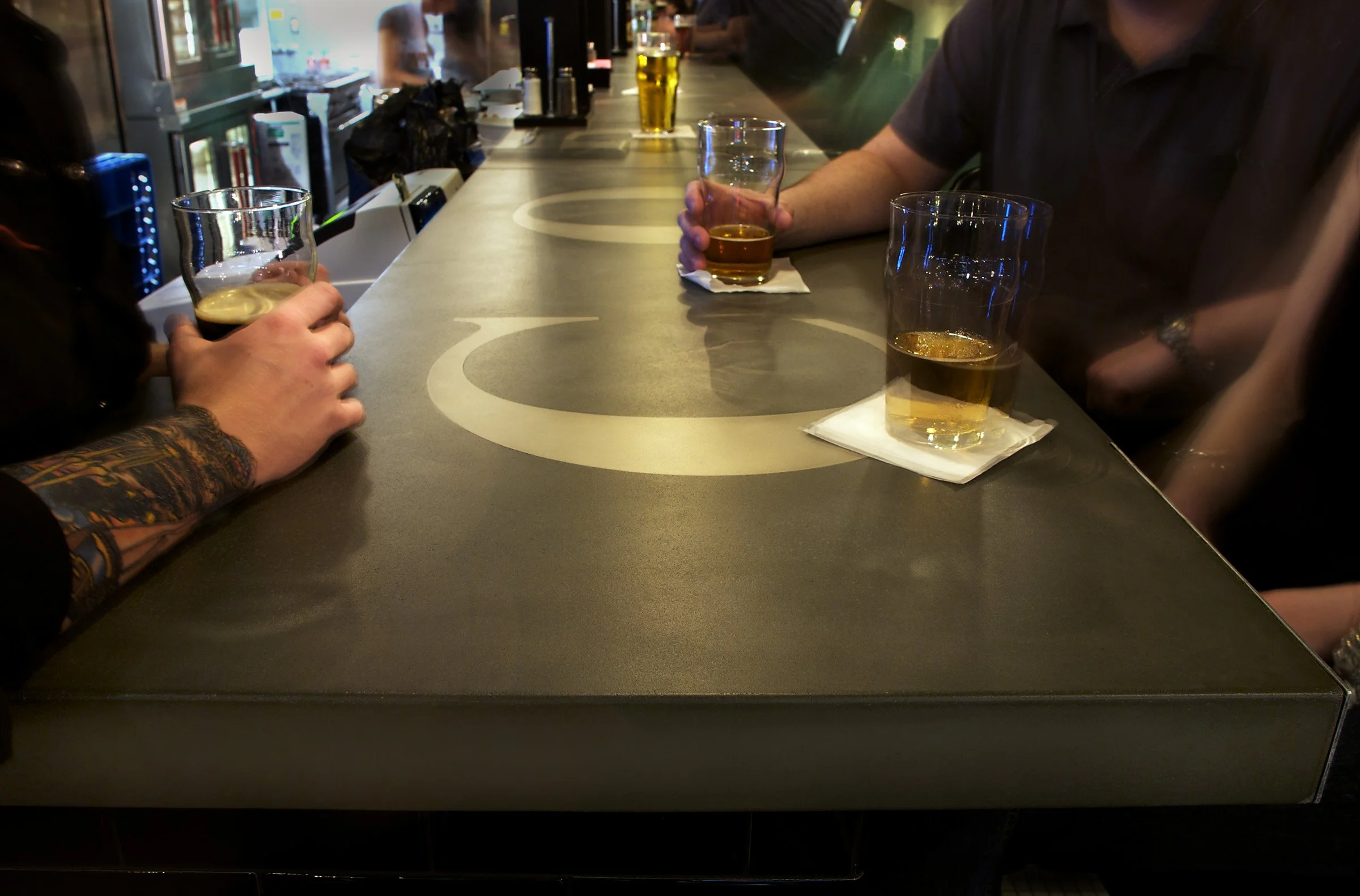 Custom restaurant bar tops blending cultural identity with durable concrete
