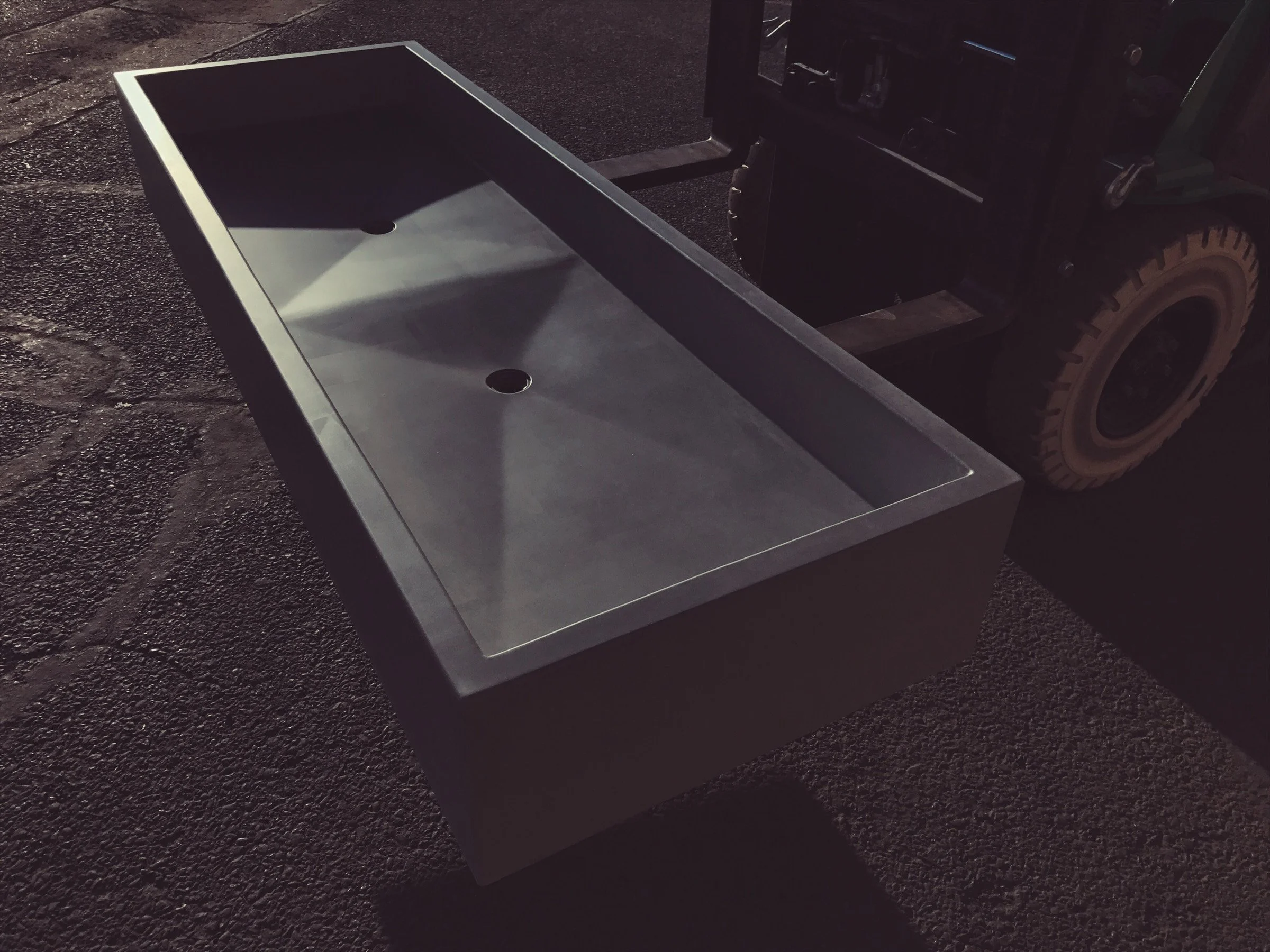 Luxury double basin concrete sink crafted in GFRC for a Barbados project. Handcrafted, durable, and made in the USA with crystalline silica-free high-performance concrete.
