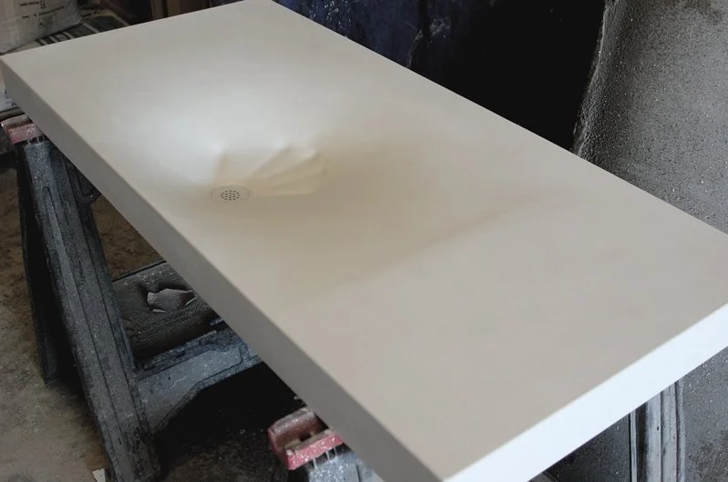 Custom UHPC concrete sink shaped like a hand impression, handcrafted in the USA.