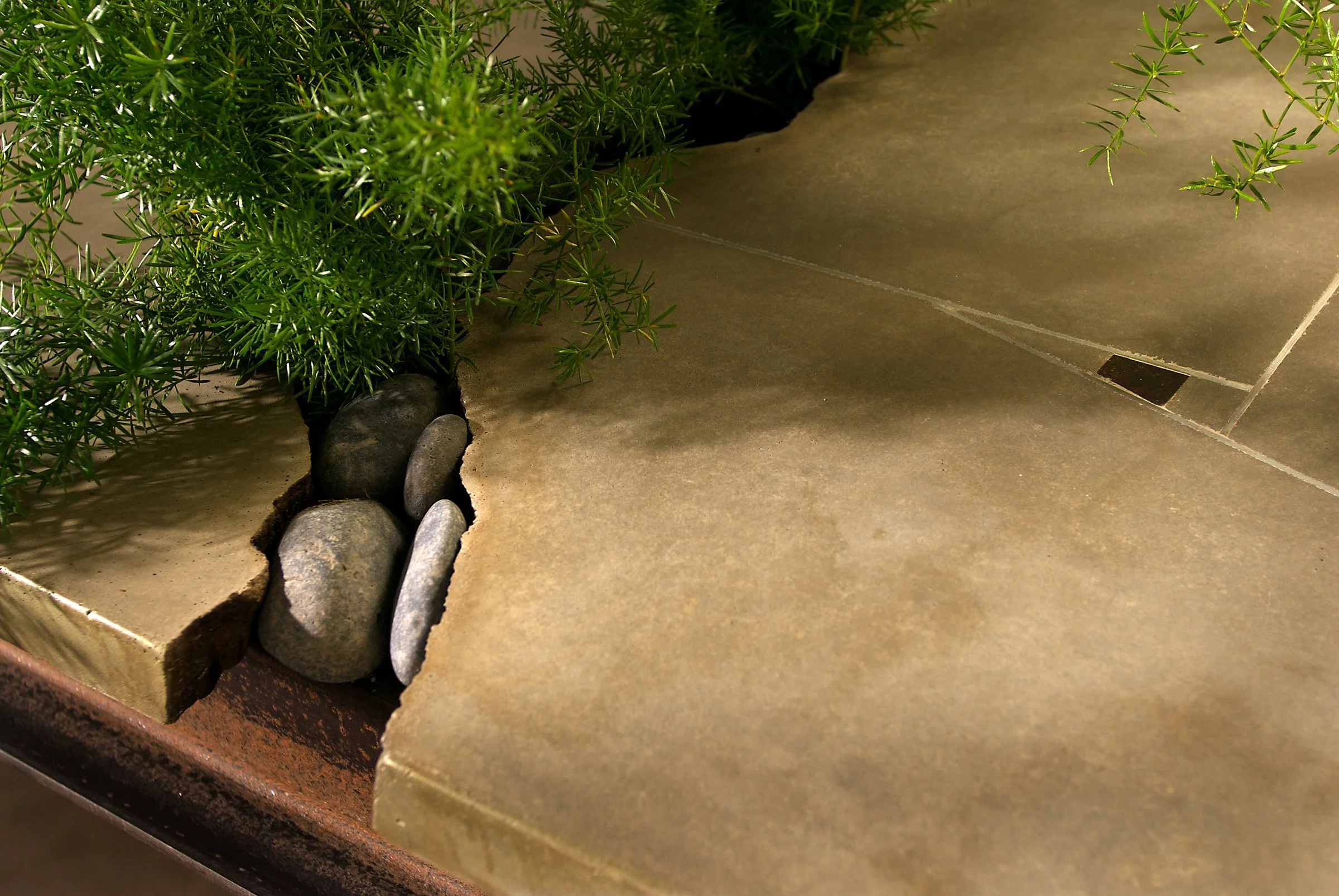 Groundbreaking cracked concrete table designed for easy transport and setup