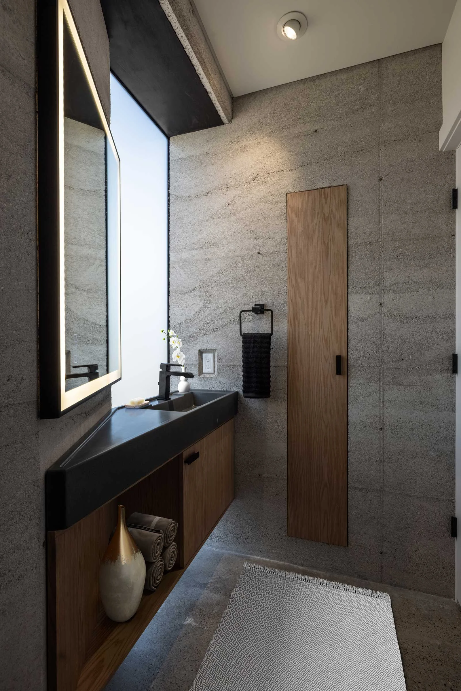 CALX Sinks, custom UHPC concrete bathroom sinks with turquoise inlays.