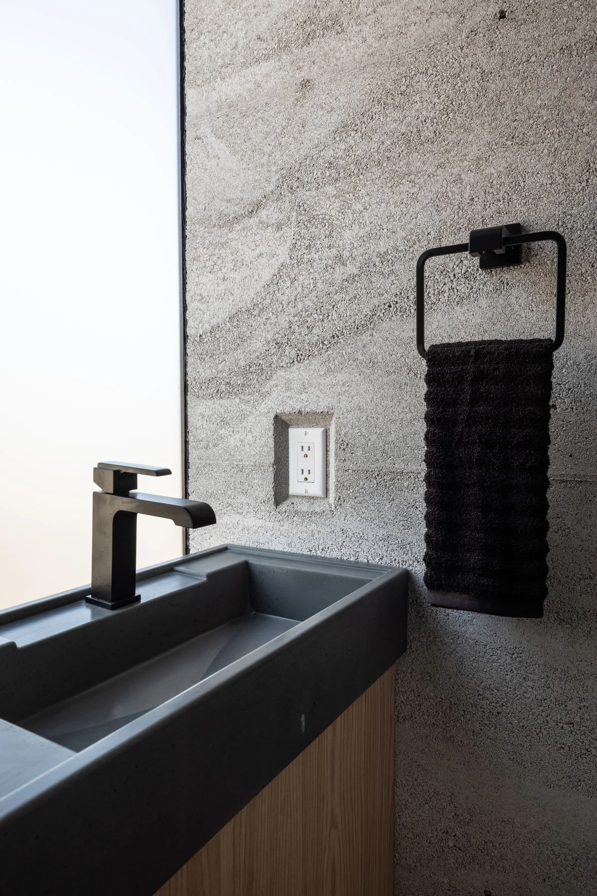Modern concrete bathroom sink with integral basin design