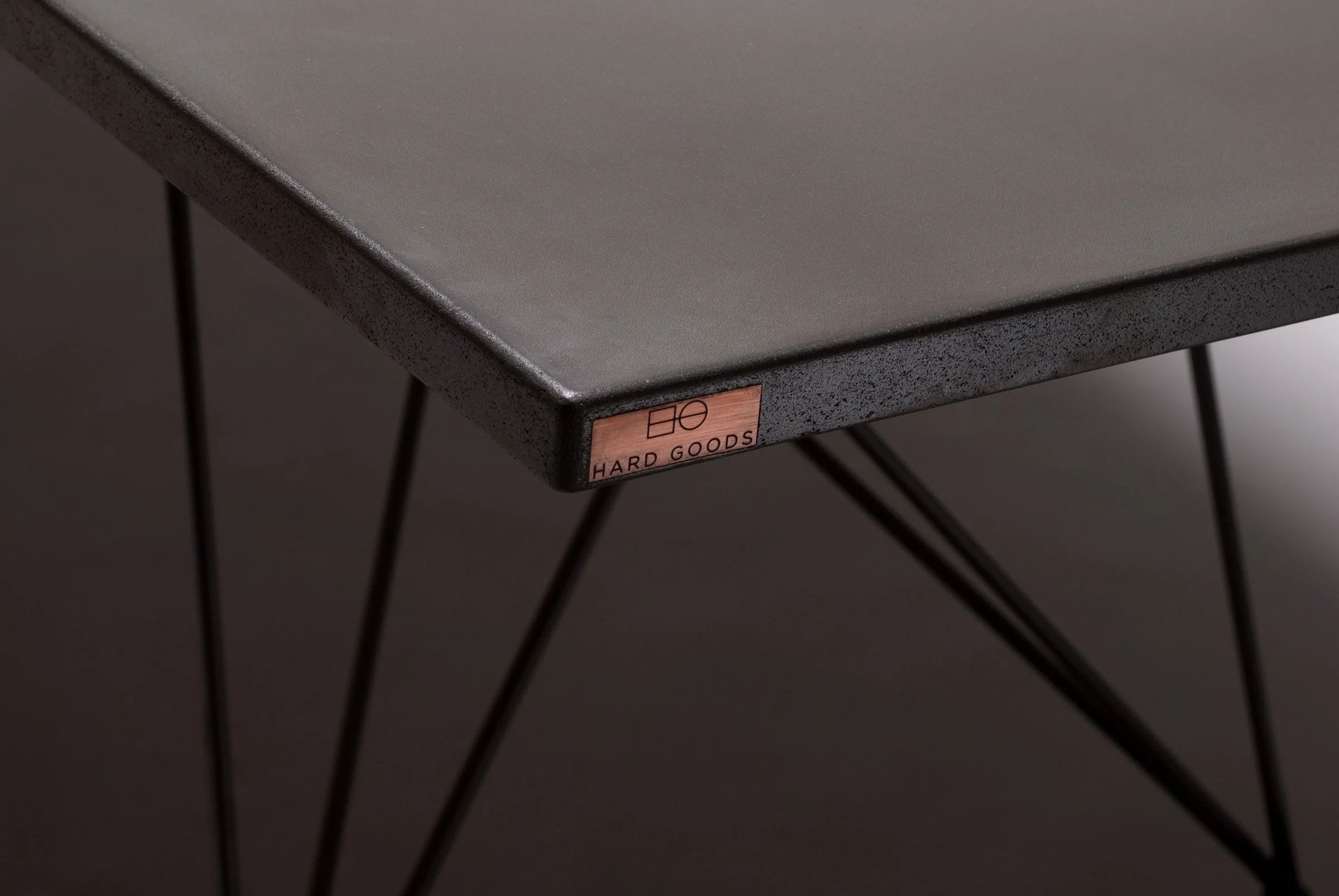 Clay-colored GFRC concrete tabletop showing X-ray view of steel base