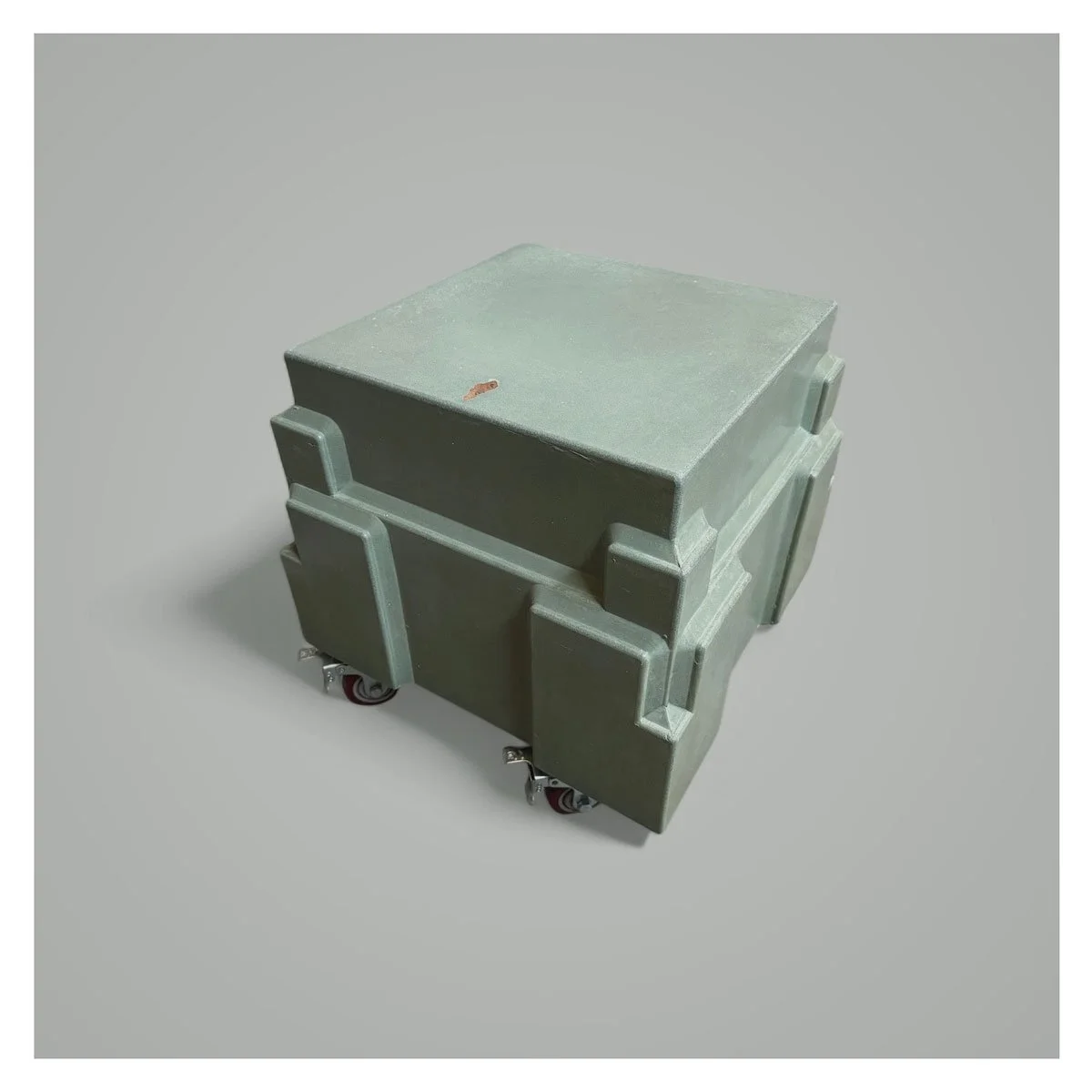 Modern concrete table on casters for versatile use.