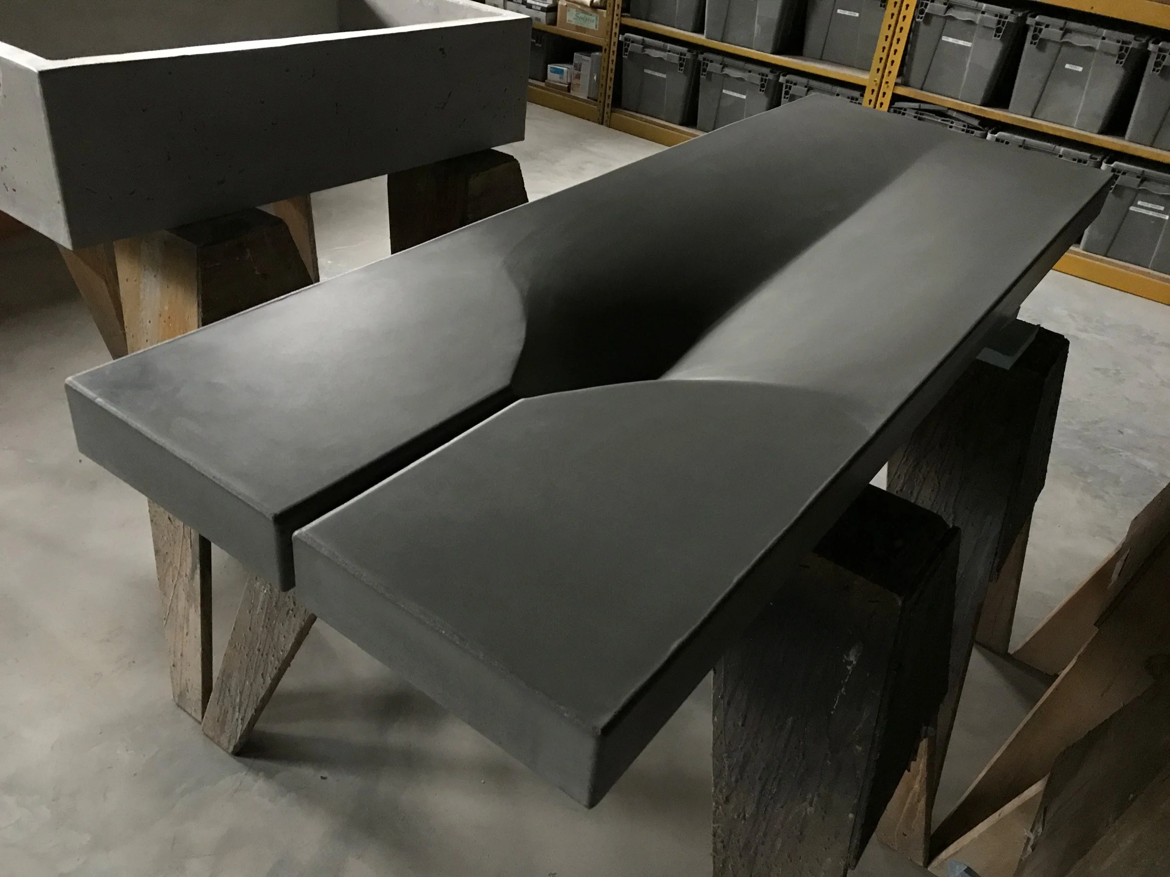 Custom artisan concrete sink with organic design crafted during a concrete workshop.