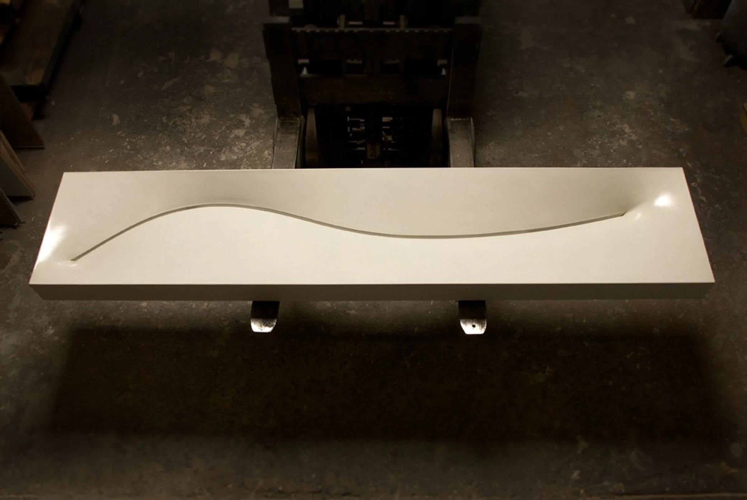 Custom double basin concrete sink with sculptural curved slot drain. A handcrafted GFRC sink made in the USA from crystalline silica-free concrete for modern spaces.