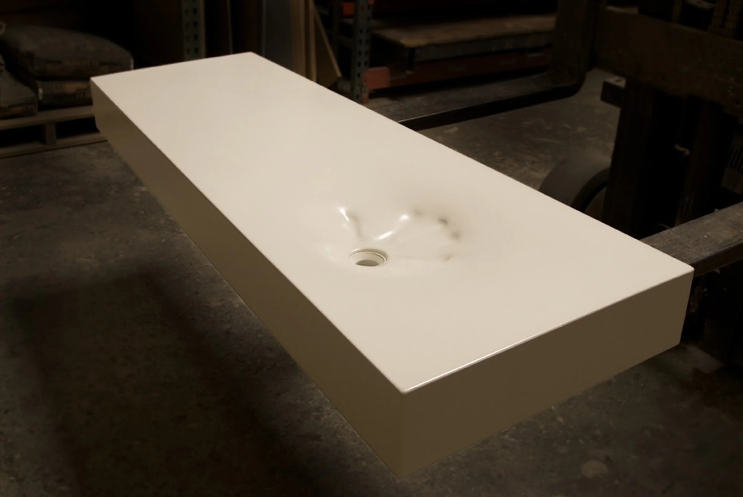Hand Sink, a fabric-formed GFRC concrete bathroom sink with organic hand-shaped design.