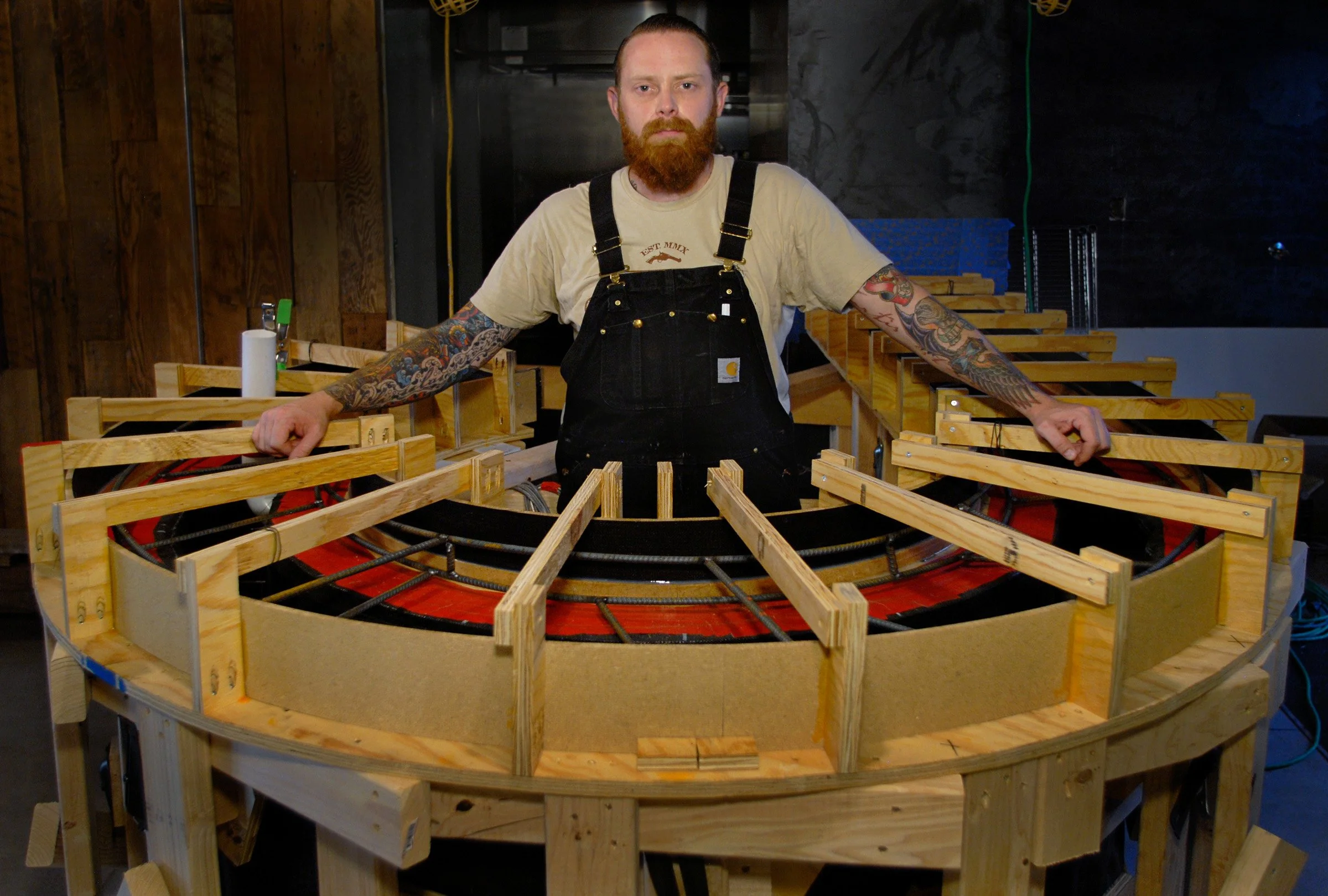 Brandon Gore working on a fabric formed concrete wall and countertop for Green Restaurant in Downtown Phoenix.