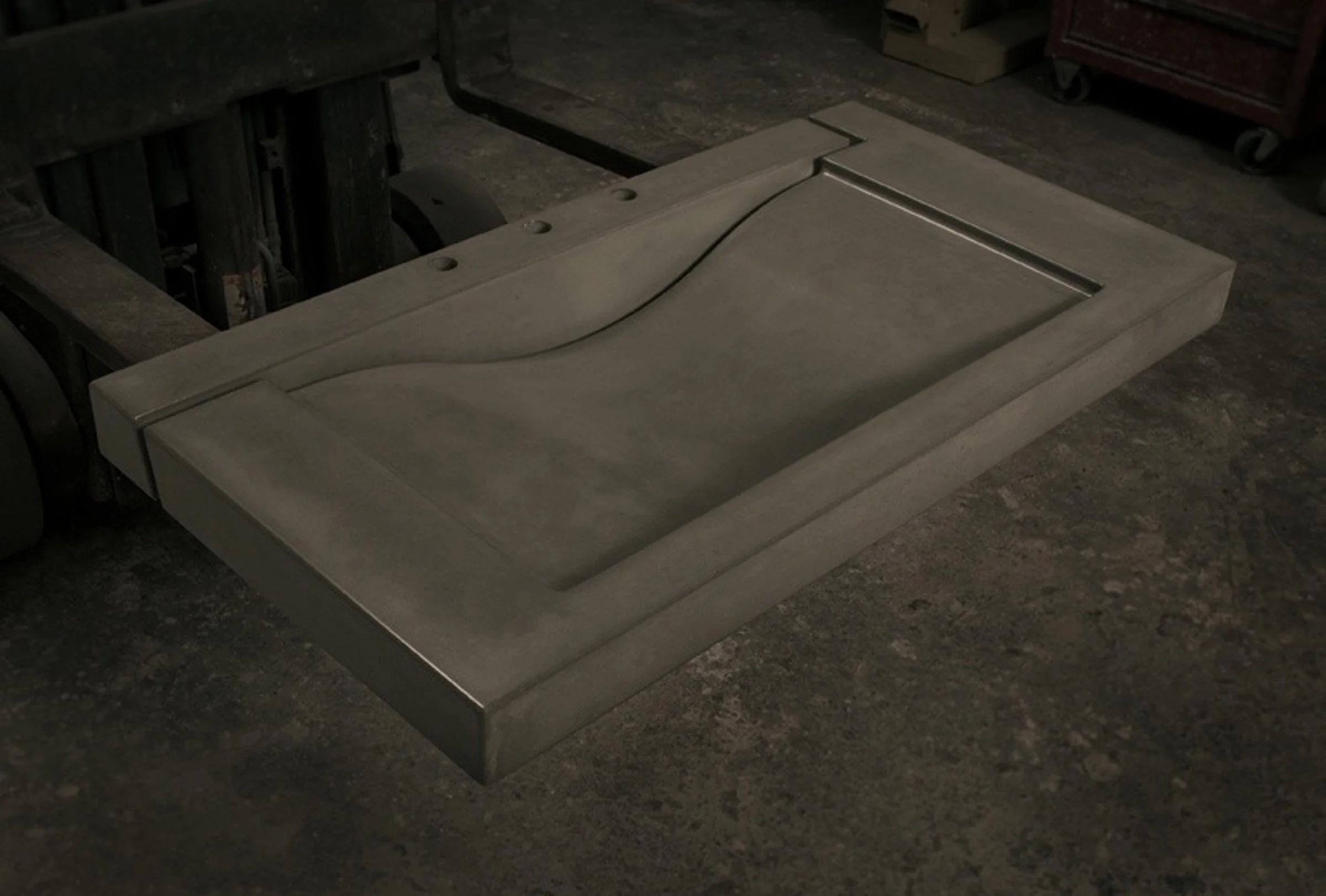 Custom wave sink for commercial or residential bathrooms, artisan-made in concrete.