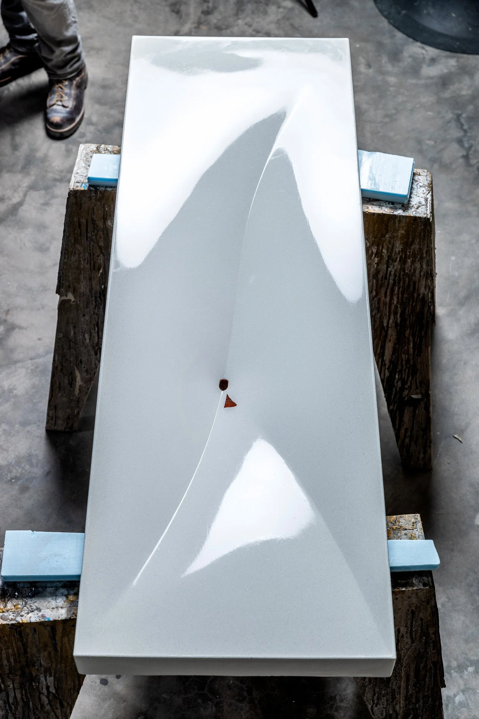 Fabric-formed GFRC sink showcasing restrained modern concrete design.
