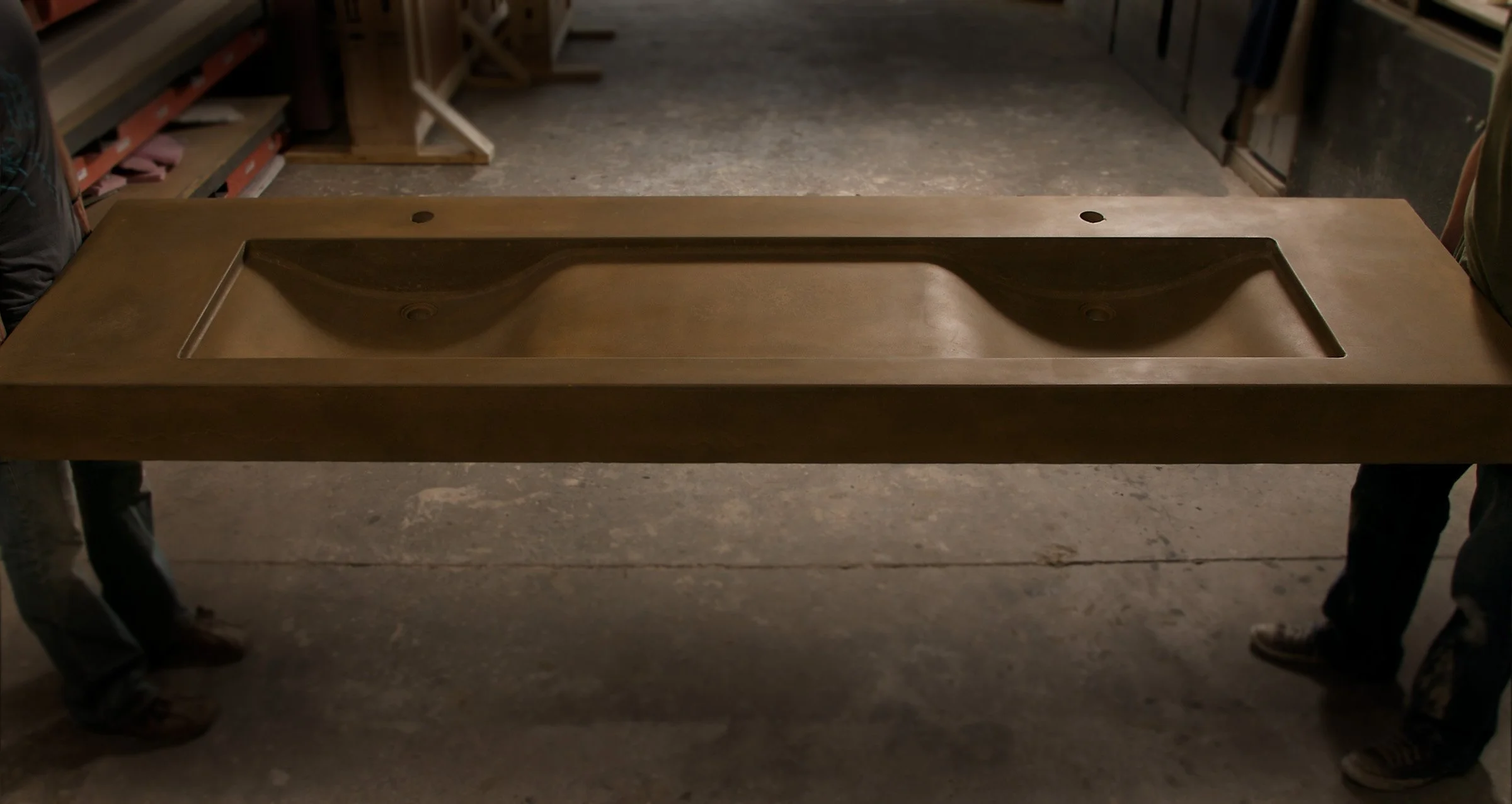 Handcrafted double basin concrete sink with sculptural wave-inspired form. Made in the USA from durable GFRC concrete for luxury bathrooms in homes, hotels, or restaurants.