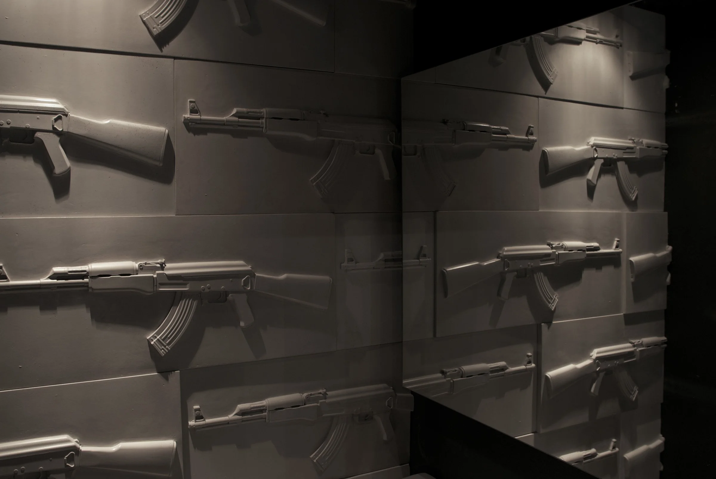 One-of-a-kind AK-47 wall tile crafted as a mold-making study in 2005