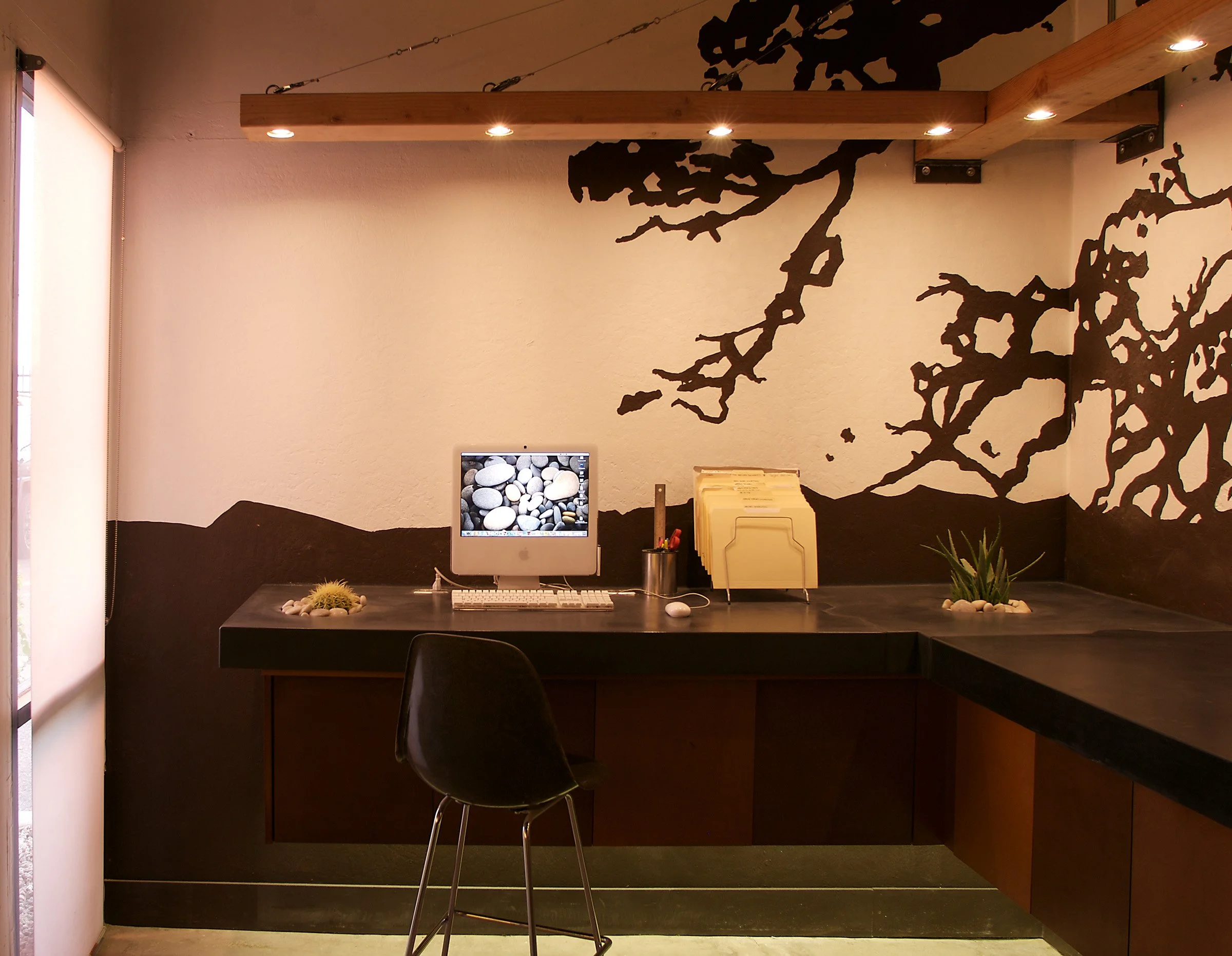 Handcrafted concrete countertops featuring integral planter design