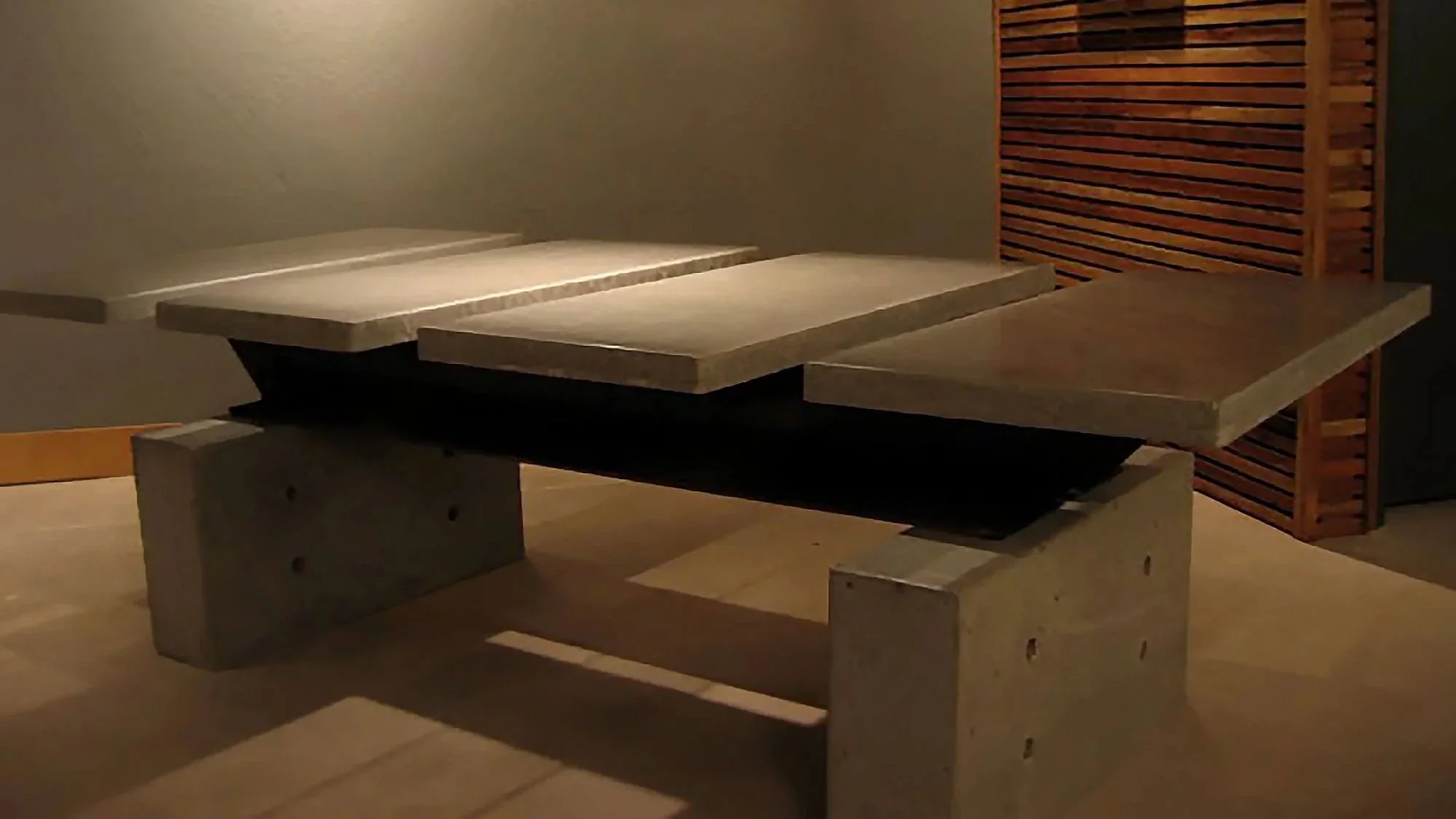 Handcrafted conference table with four slab concrete top.