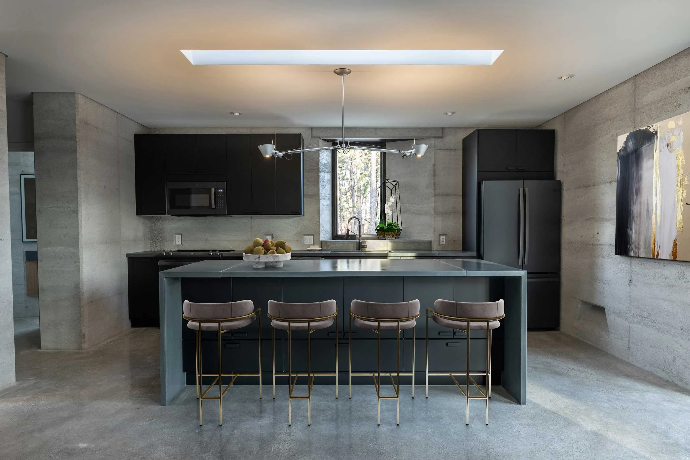 Handcrafted concrete countertops with turquoise stone inlays for modern kitchen