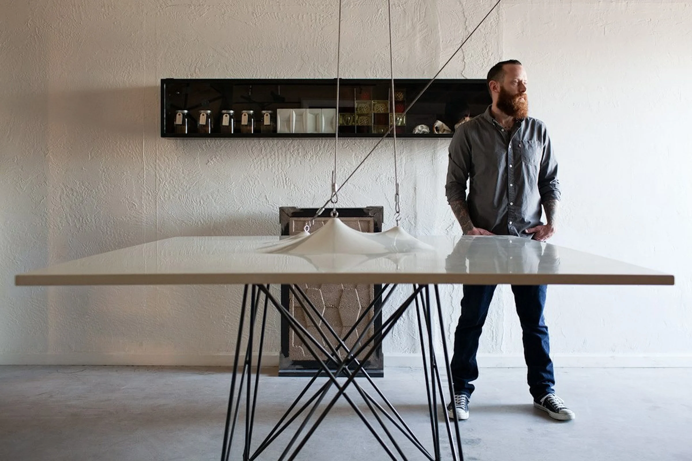 Custom concrete and steel conference table with fabric-formed centerpiece. A landmark 2010 project introducing GFRC concrete and healthy, reactive sealers.