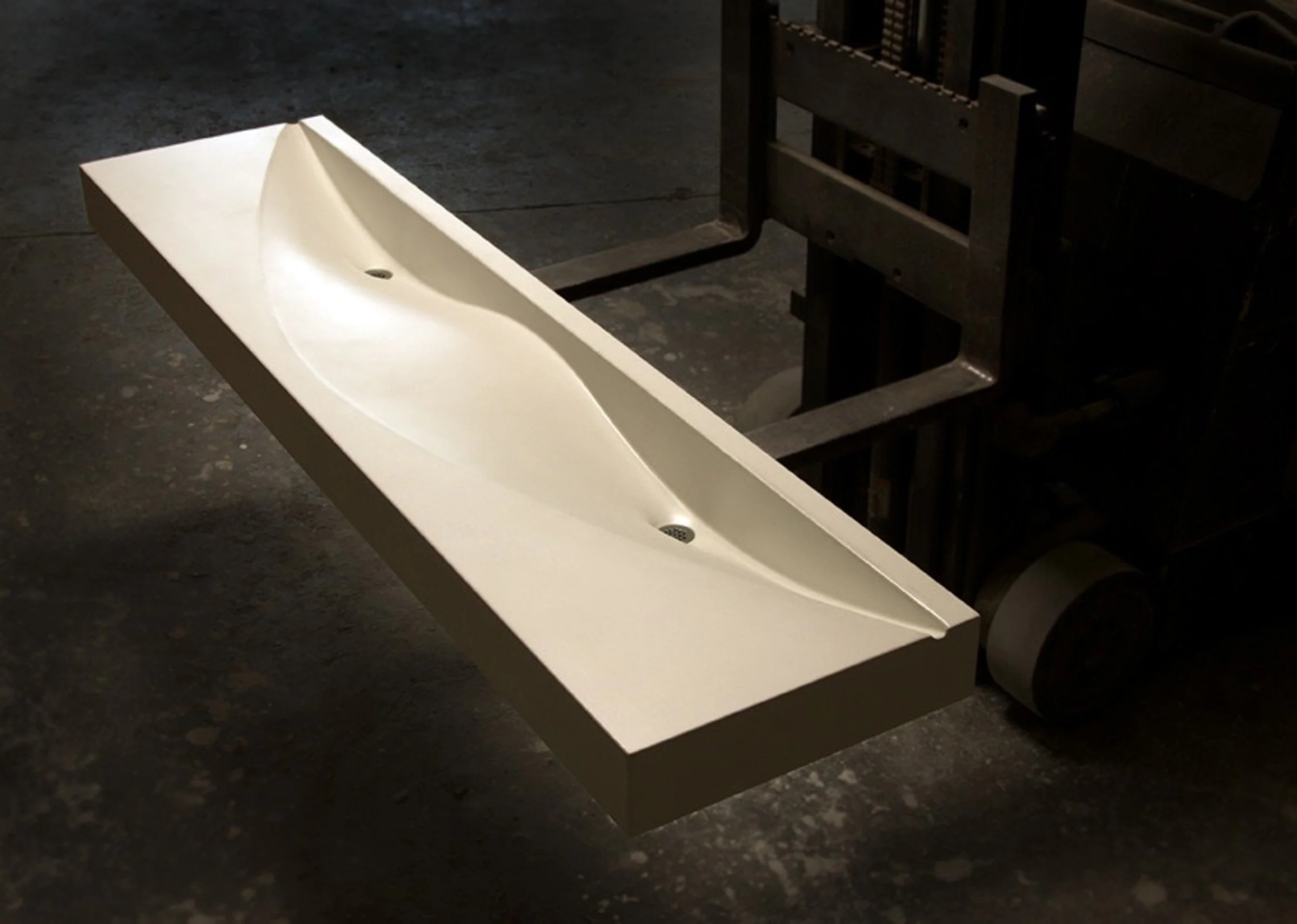 Luxury double basin concrete sink with flowing fabric-formed design. Handcrafted from durable GFRC for residential, hotel, or restaurant bathroom projects.