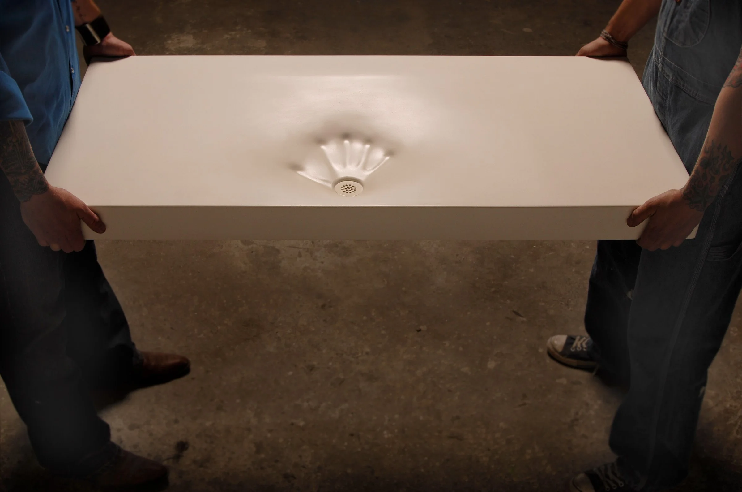 Custom fabric-formed concrete sink showing innovation in bathroom design.