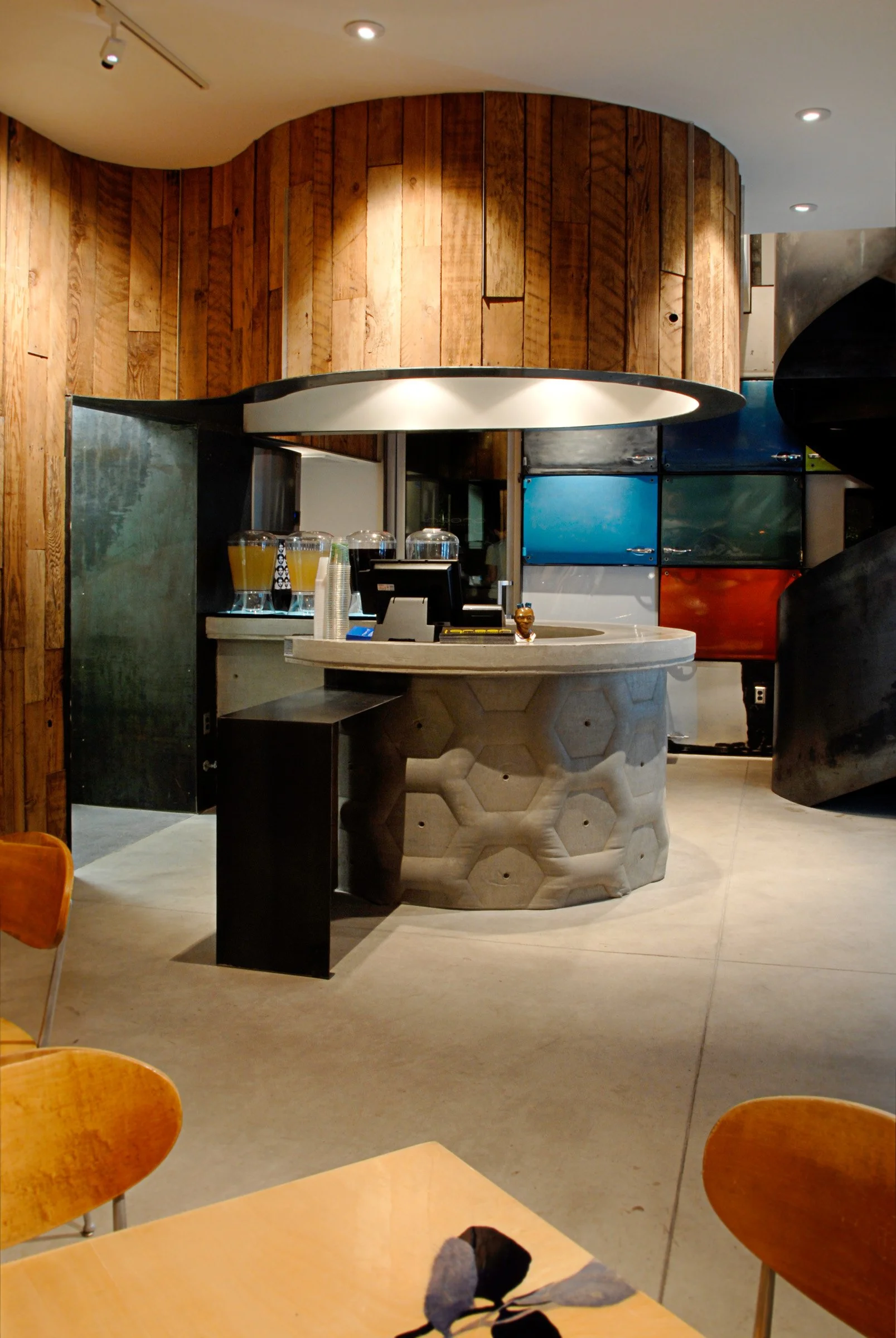 Custom restaurant order counter made from fabric-formed concrete with hexagon design