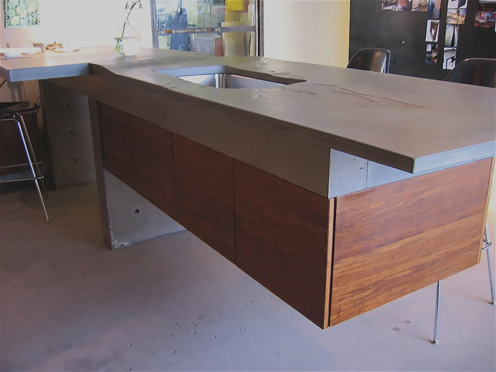 Innovative cantilevered concrete countertop designed by Gore Design Co.