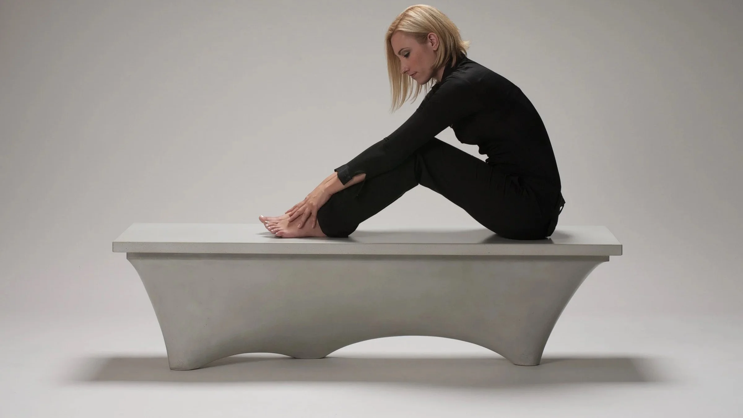 Clay-colored GFRC concrete bench with hollow lightweight design