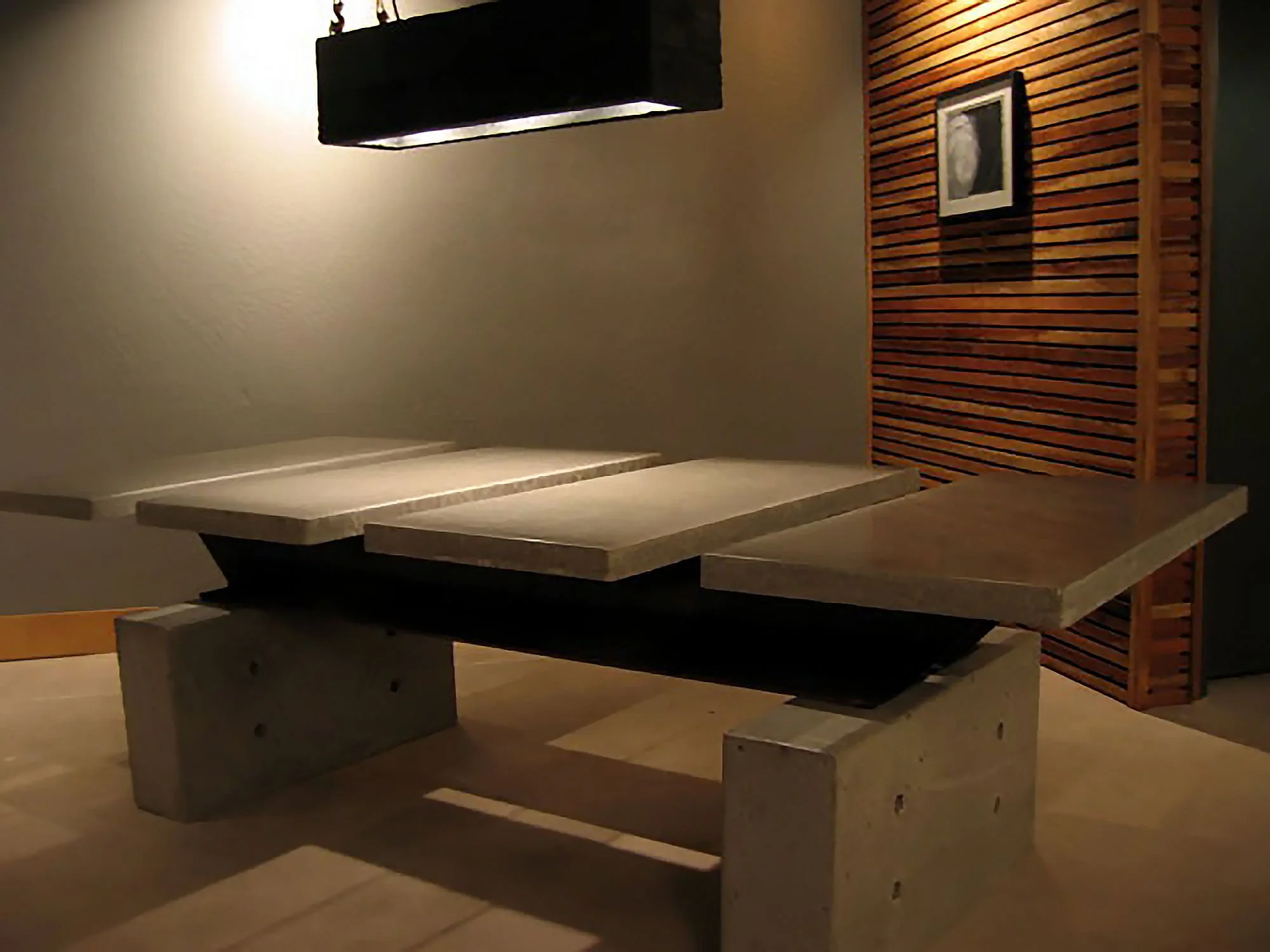 Durable concrete and steel conference table furniture.