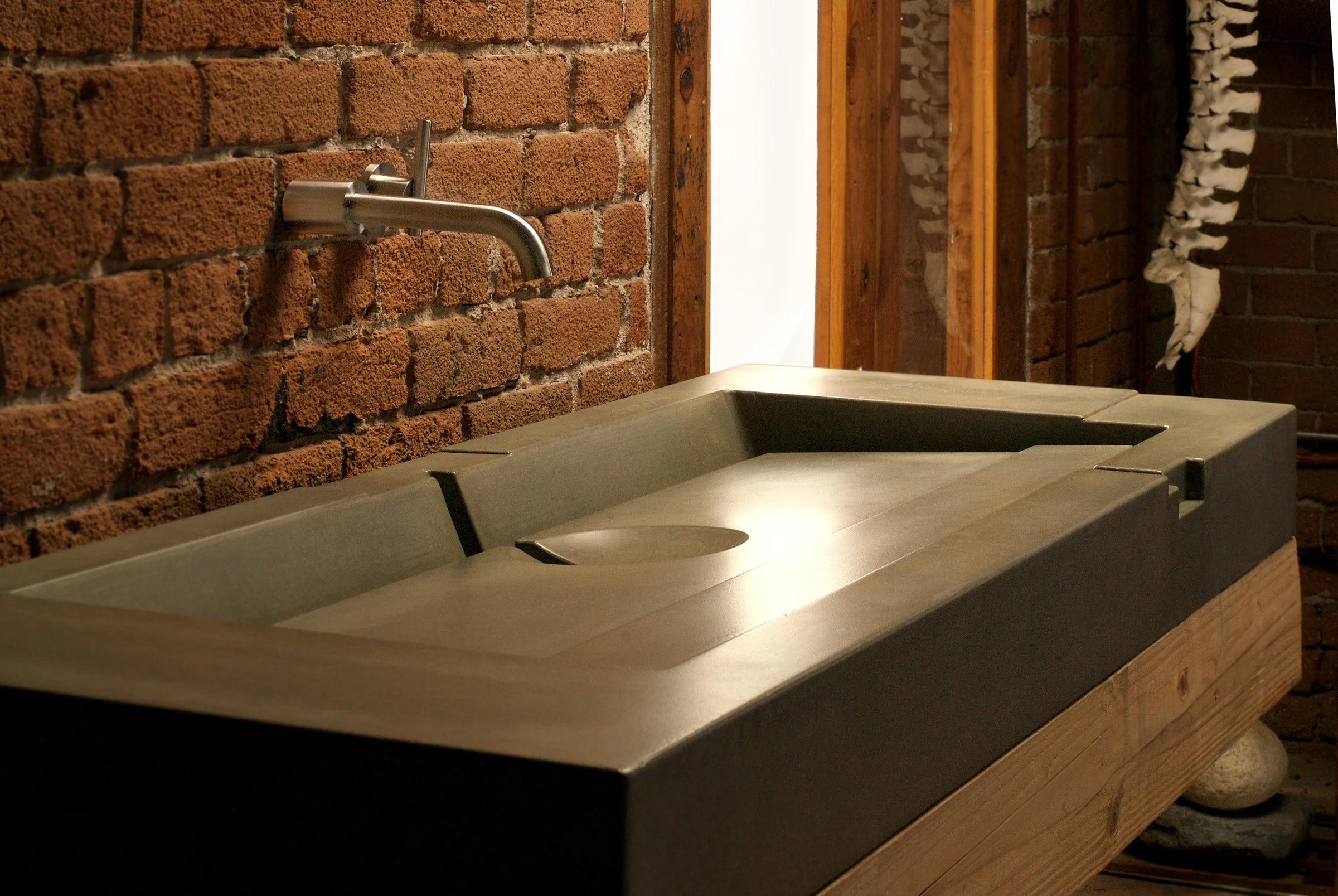 Luxury concrete bathroom sink with bold geometric design.