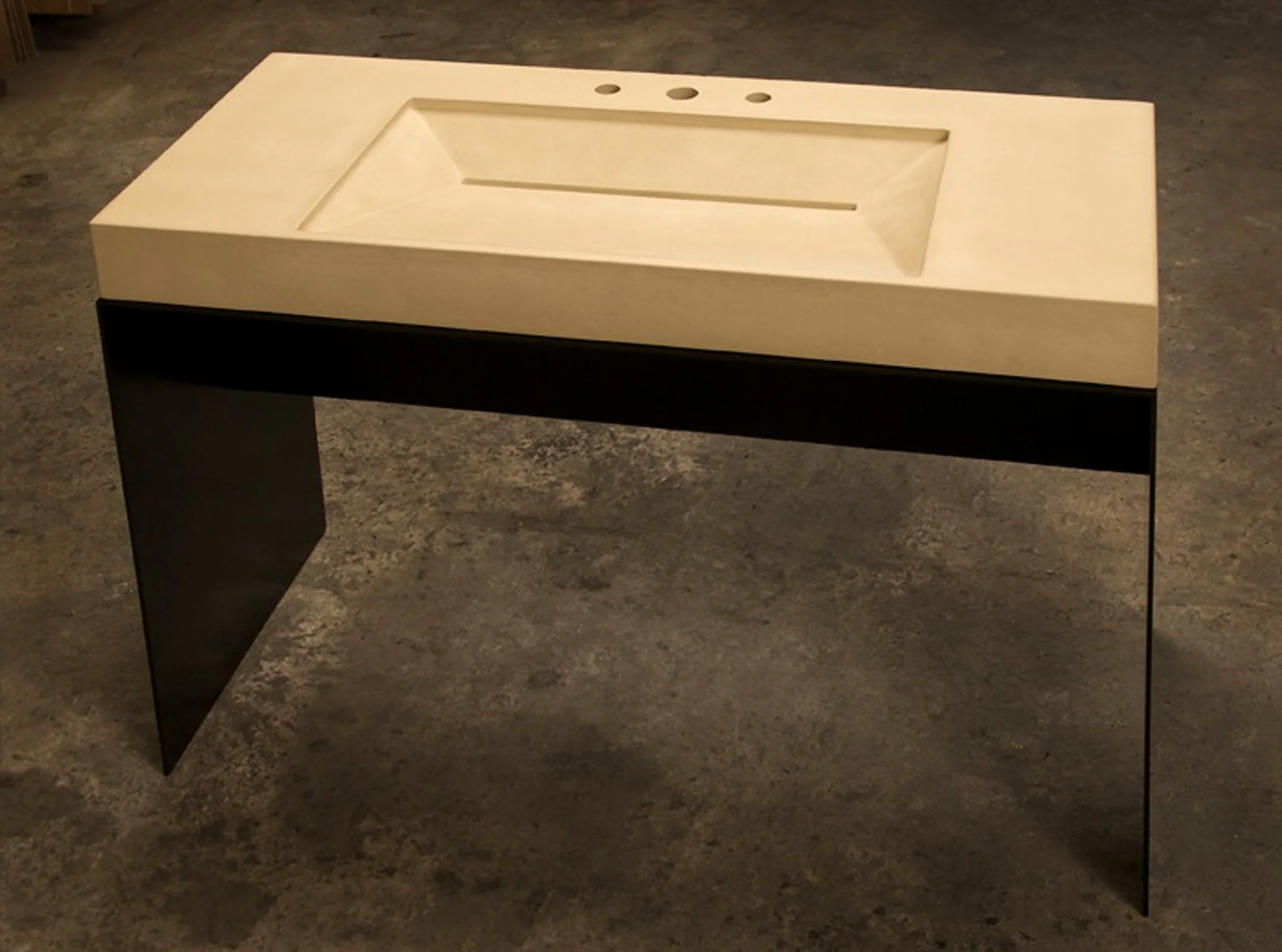 Handcrafted GFRC bathroom ramp sink made in the USA with luxury steel base.