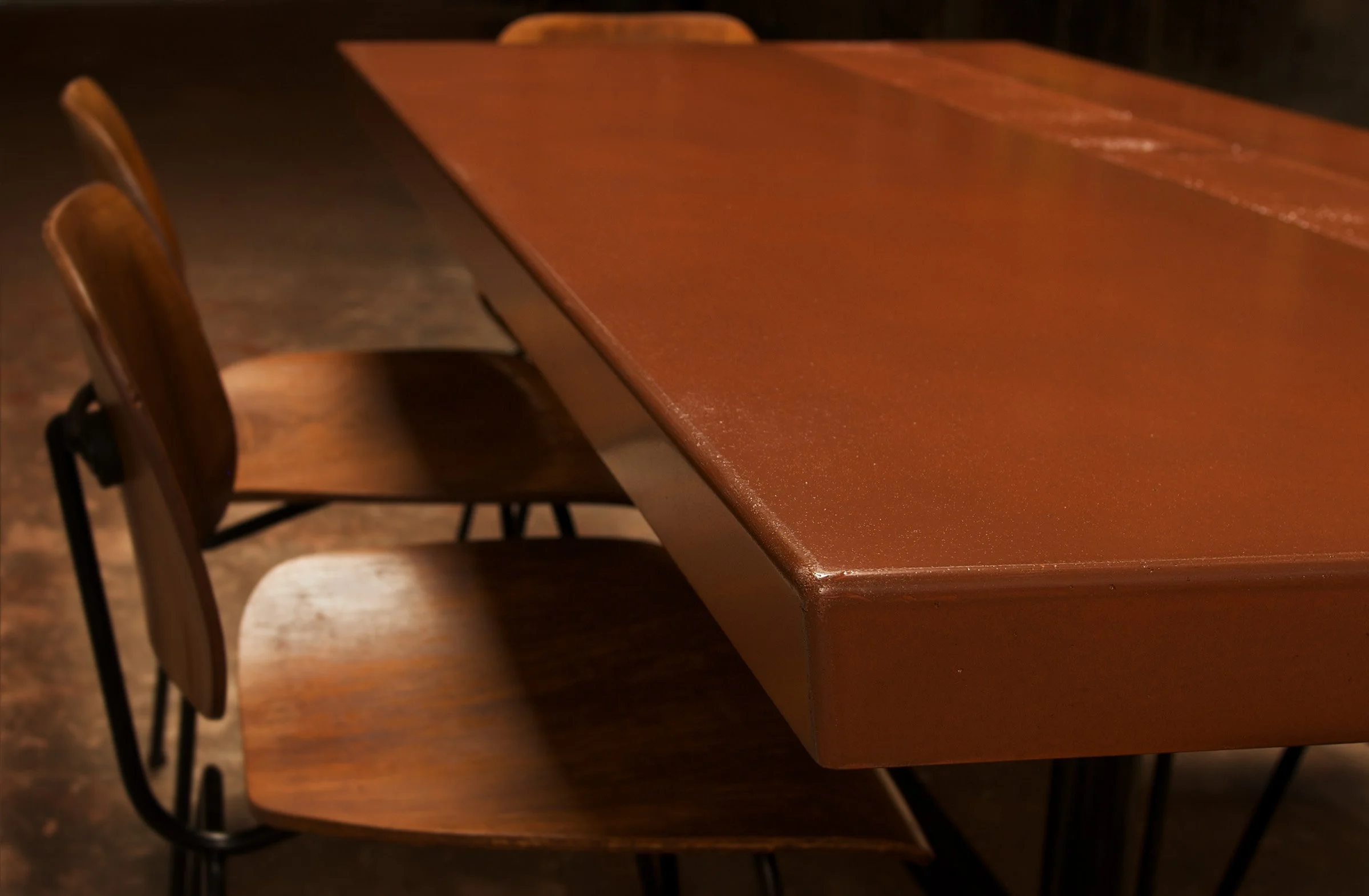 Sunnyslope concrete dining table in Frank Lloyd Wright Cherokee Red color