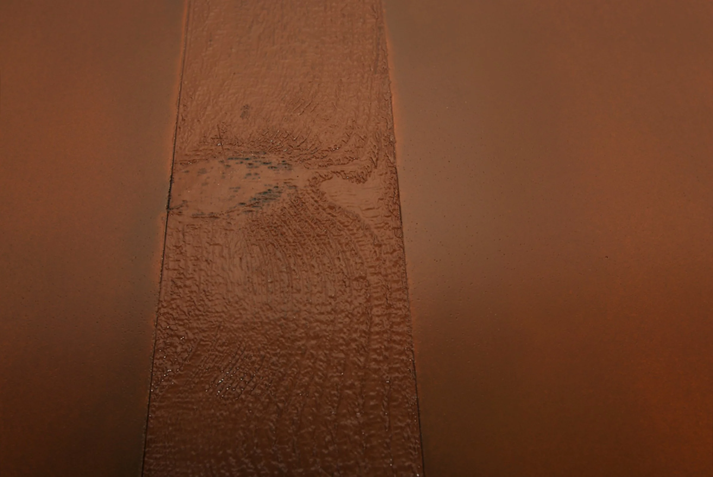 GFRC concrete tabletop with rough-sawn wood texture detail and custom edge