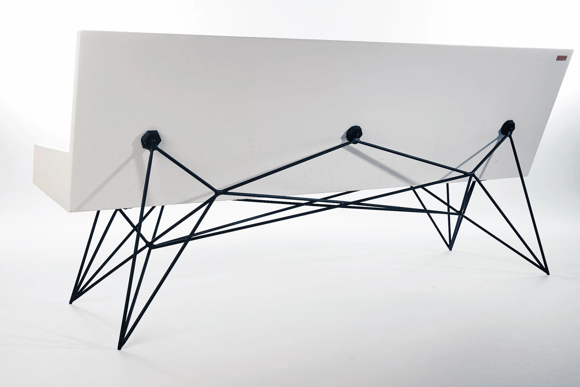 Modern concrete and steel bench with custom three-point black steel base