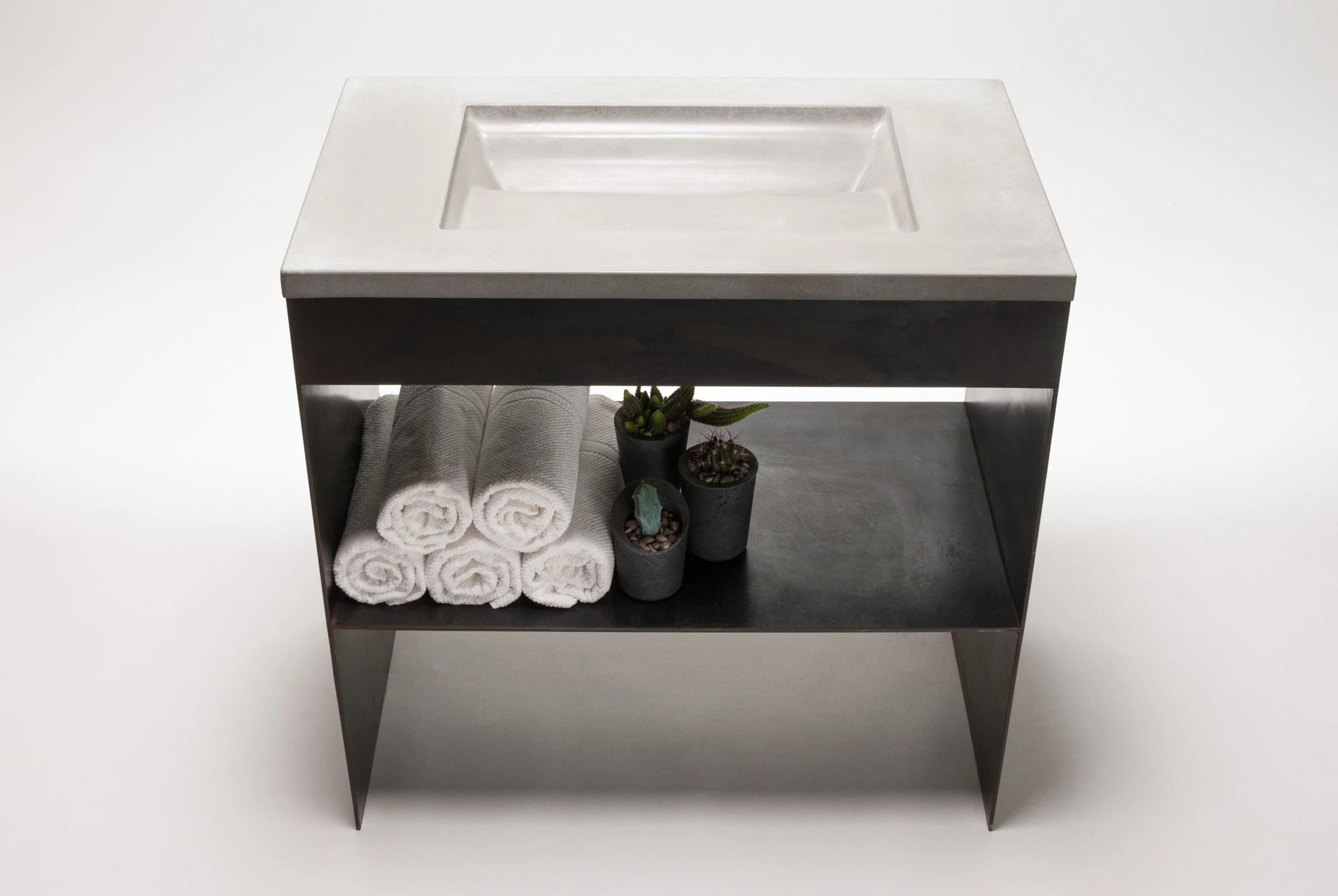 Wave-inspired UHPC concrete sink prefabricated for easy installation. Handcrafted in the USA with healthy sealers - artistry and performance at an accessible price point.
