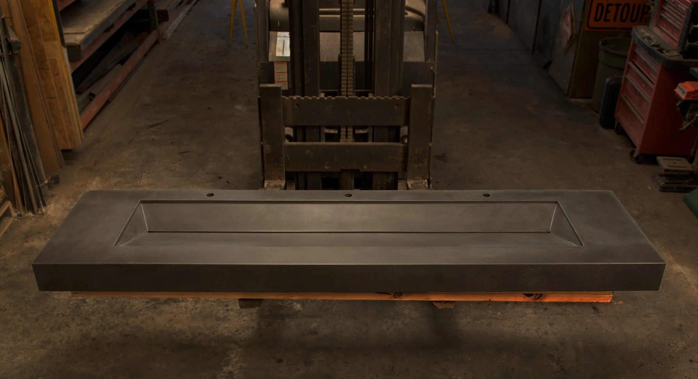 Luxury triple faucet ramp sink with overflow prevention system. Made from high-performance GFRC concrete, handcrafted for restaurants, hotels, and public spaces.