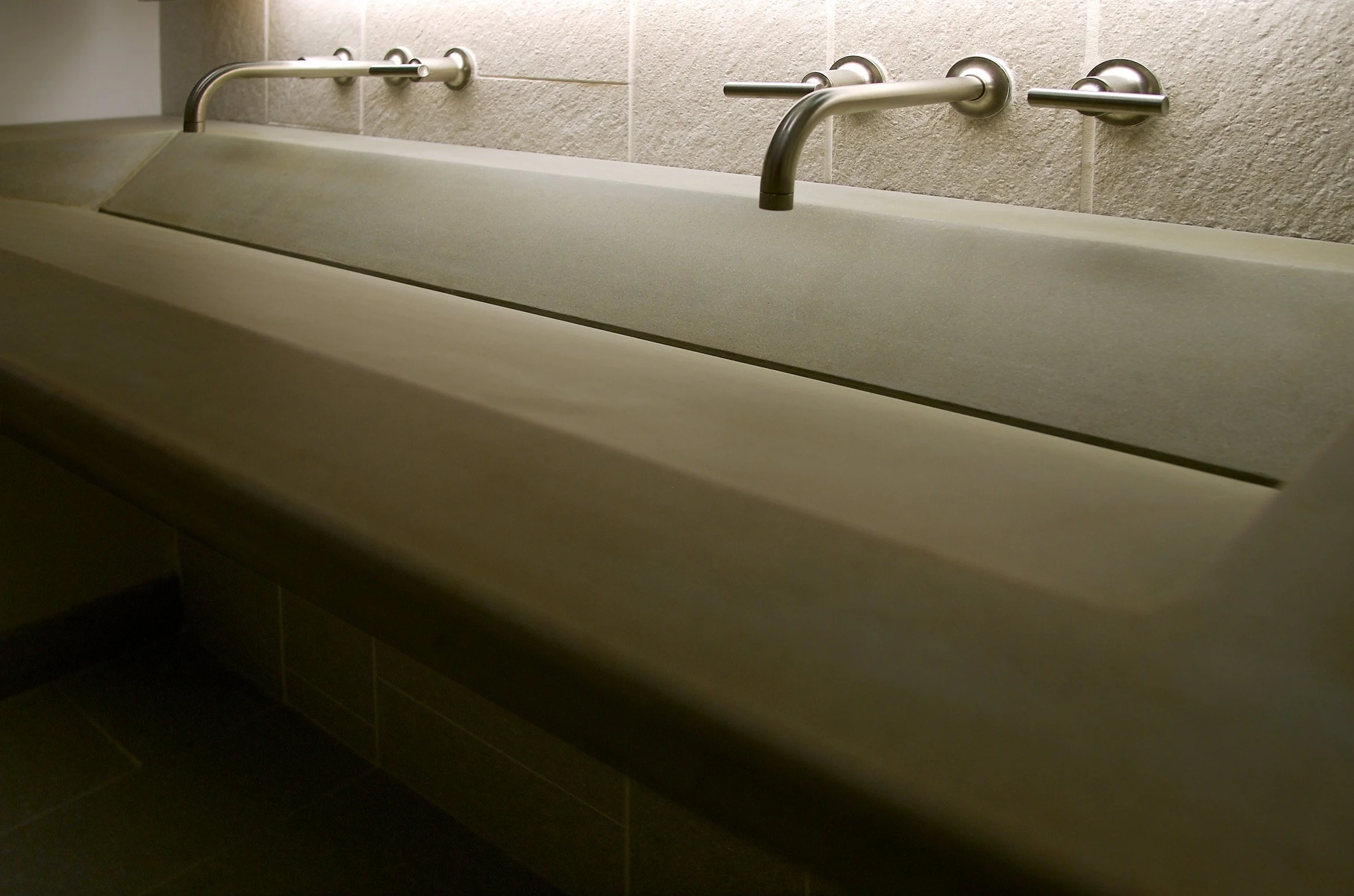 Double ramp concrete sink designed for functionality and architectural style.