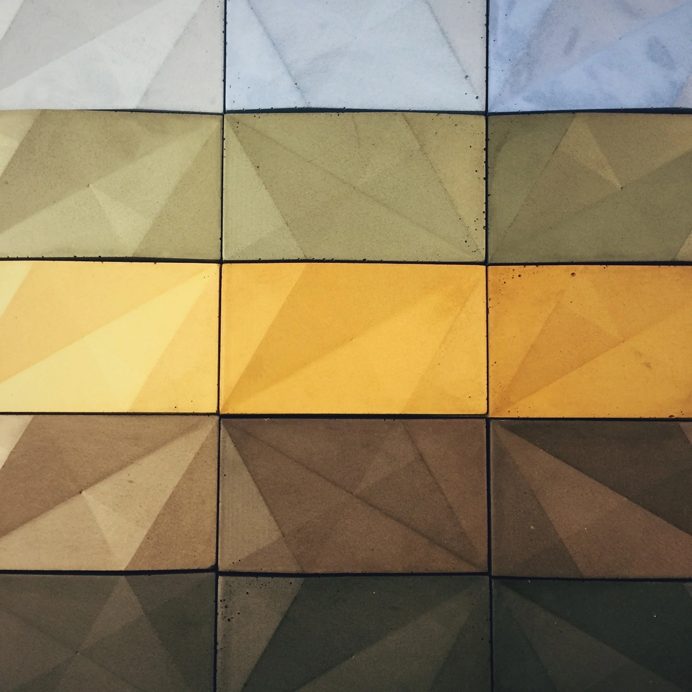 Colorful custom concrete tile in bright colors.
