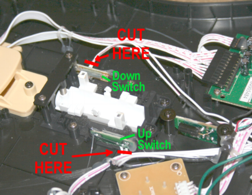 Internal wiring and circuit board components with instructions to cut wires, including a down switch and up switch.