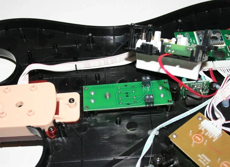 Internal electronic components of a device, including circuit boards, wires, and connectors.