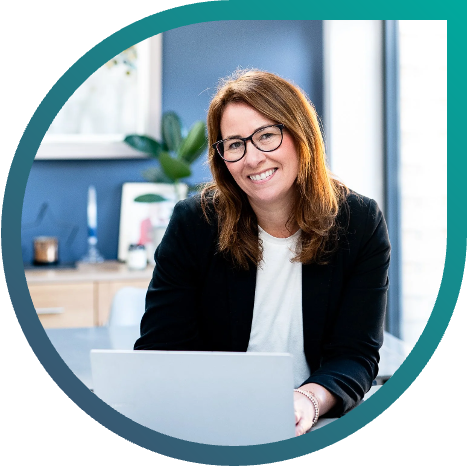 Catherine Keddie, executive coach and leadership consultant, working at a desk