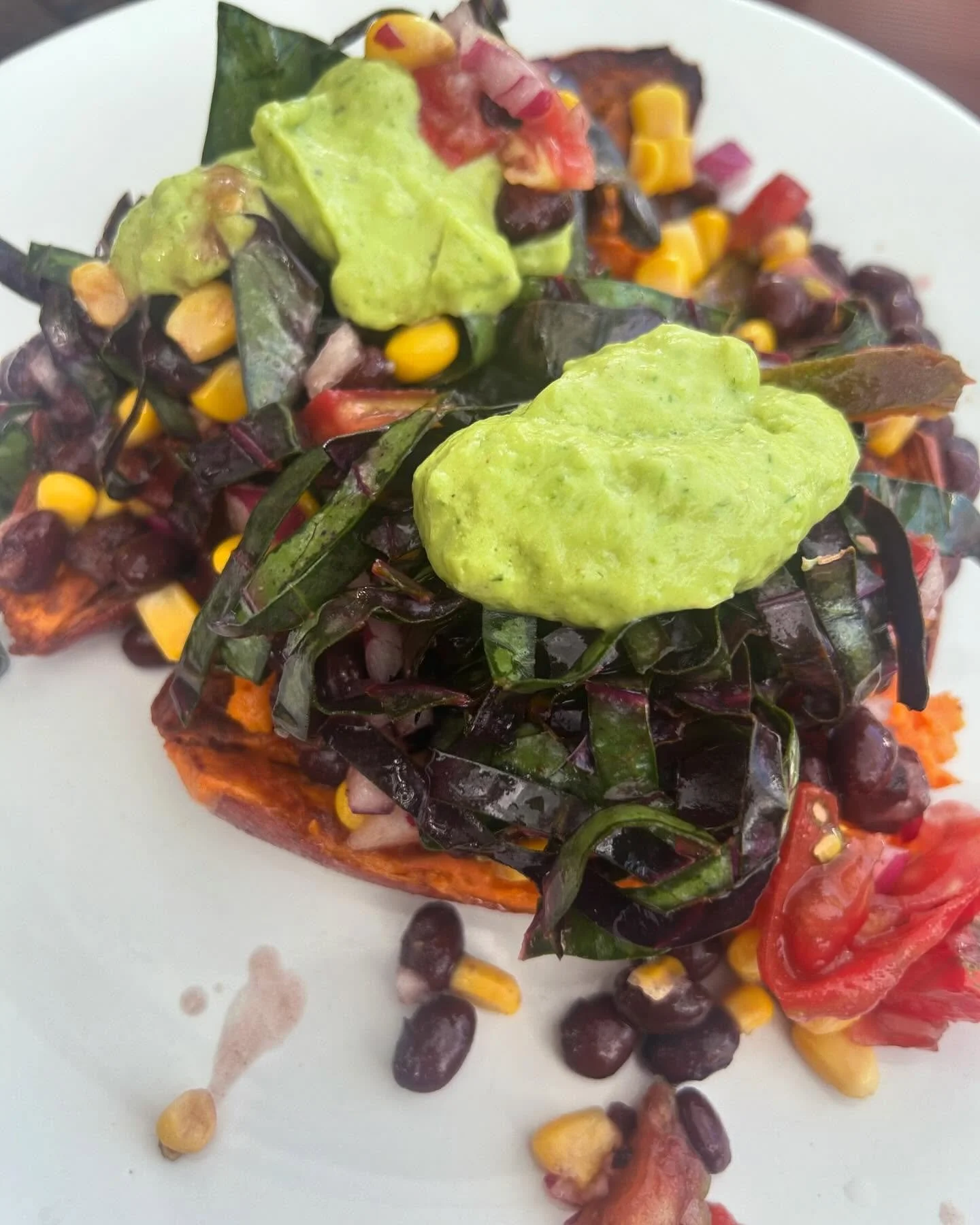 Sweet Potato Stack 
.
Roasted Sweet Potato 
. 
Corn, Black Bean, Tomato, &amp; Purple Onion Medley 
. 
Purple Coleslaw 
. 
Avocado, Cilantro, Jalape&ntilde;o, &amp; Lime Sauce