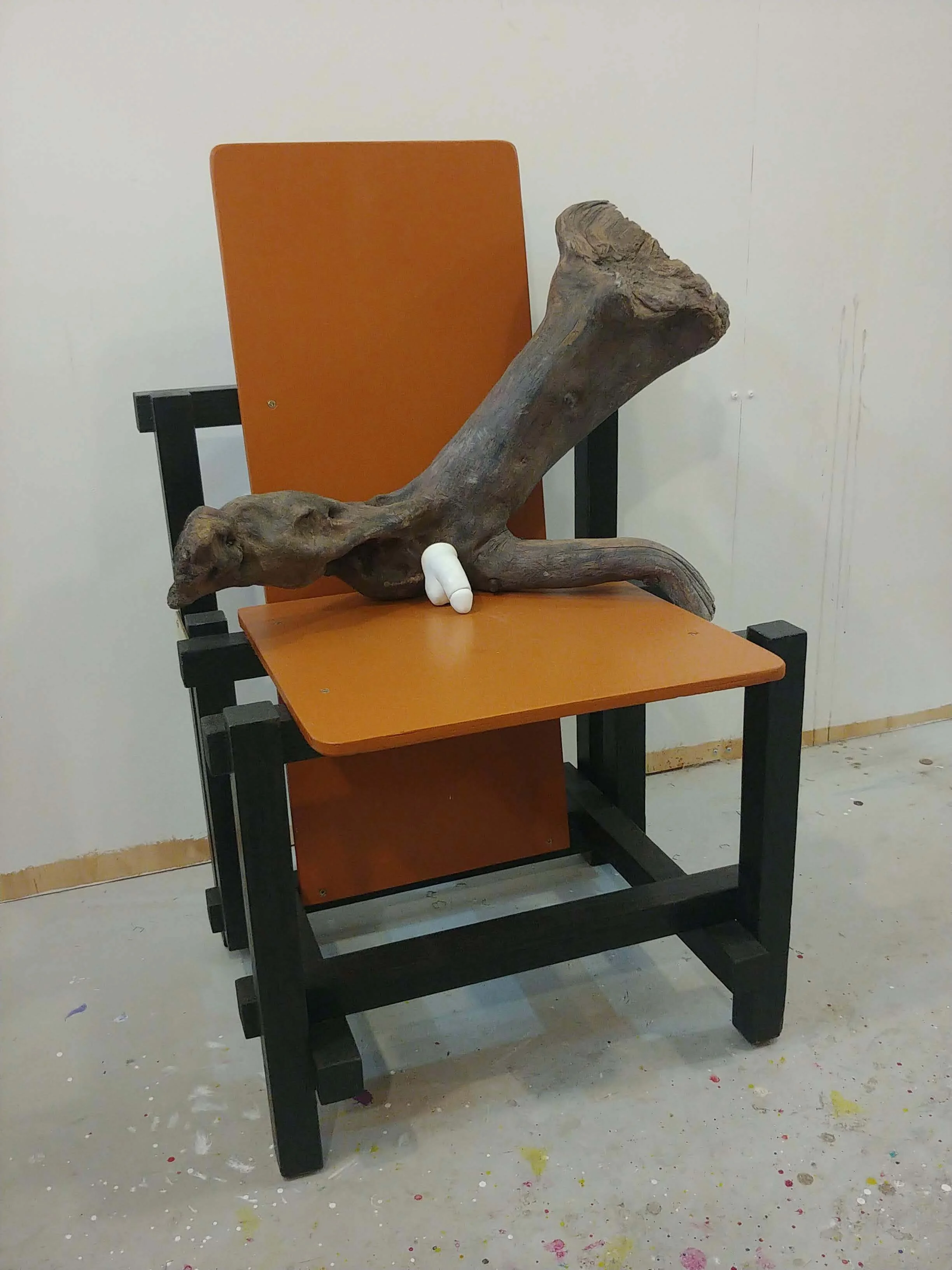 Half a Wooden Man on a Rietveld Chair
