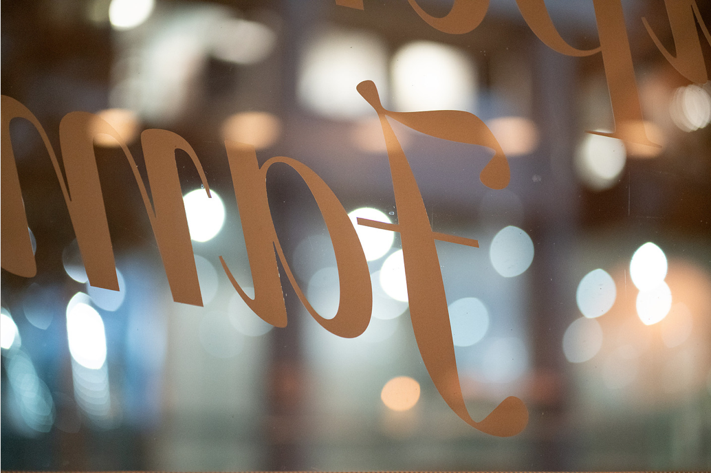 View of window vinyls from inside the cafe